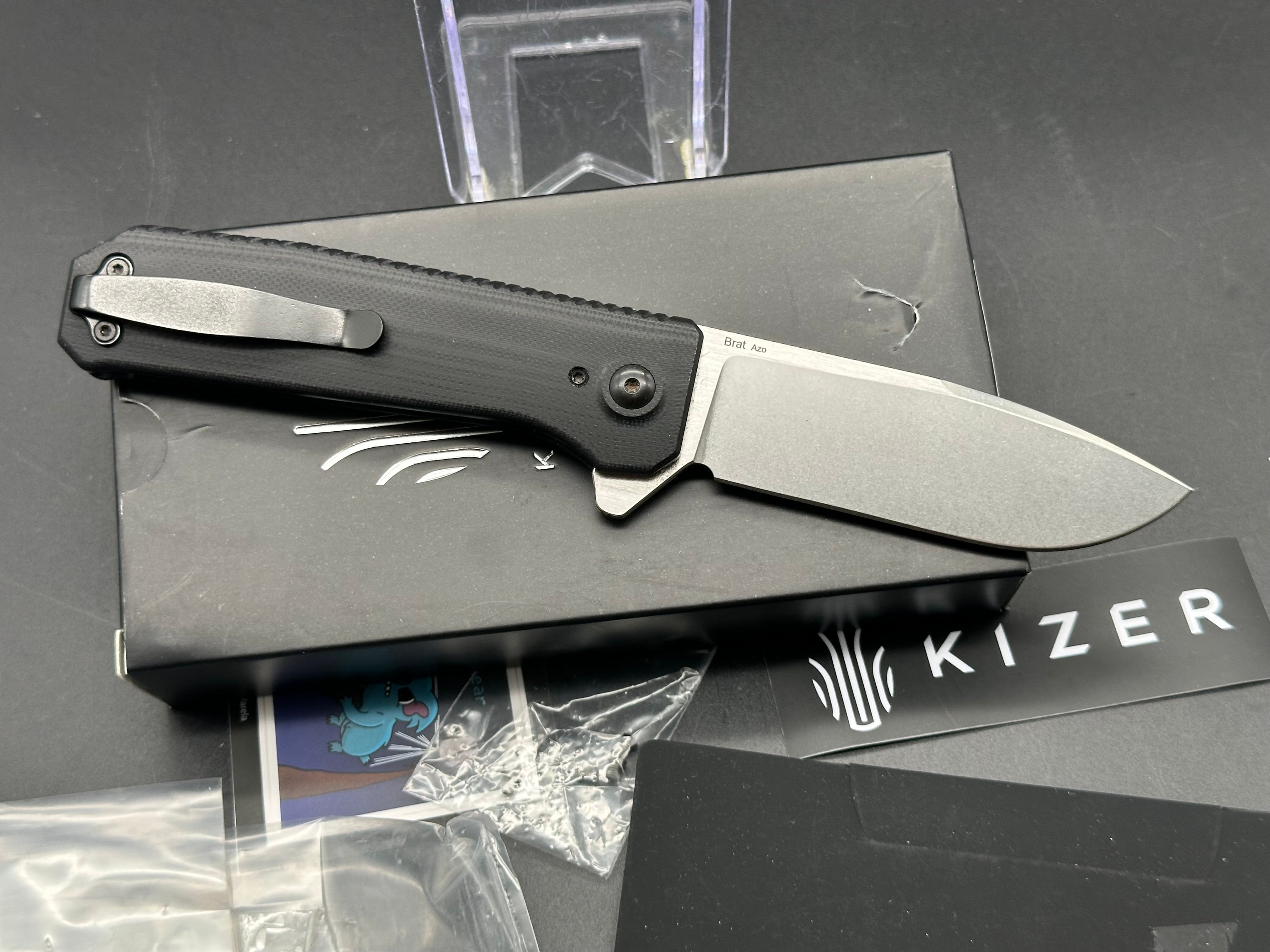 KIZER BRAT Button Lock Folding Knife - Black G10 Handle, 154CM Stainless Steel Plain Edge Blade - EDC Pocket Knife for Camping, Hiking & Outdoor Activities