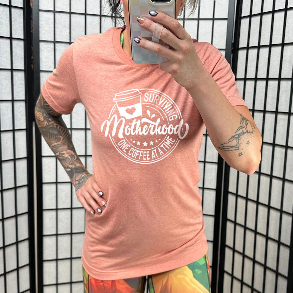 Funny Unisex T-Shirt 'Surviving Motherhood One Coffee at a Time' - Perfect Gift for Moms, Coffee Lovers - Great for Mother's Day, Baby Showers & Everyday Wear