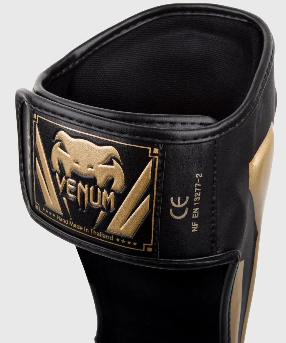 VENUM Elite Black/Gold Shin Guards - MMA, Muay Thai & Kickboxing Protective Gear for Training & Competition