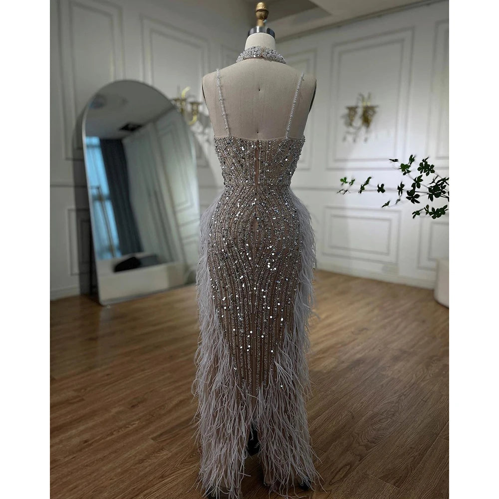 Elegant White Nude Mermaid Evening Gown with Spaghetti Straps, Beaded Details & Feather Hem - Perfect for Prom, Wedding Guest, and Formal Events - LA72047