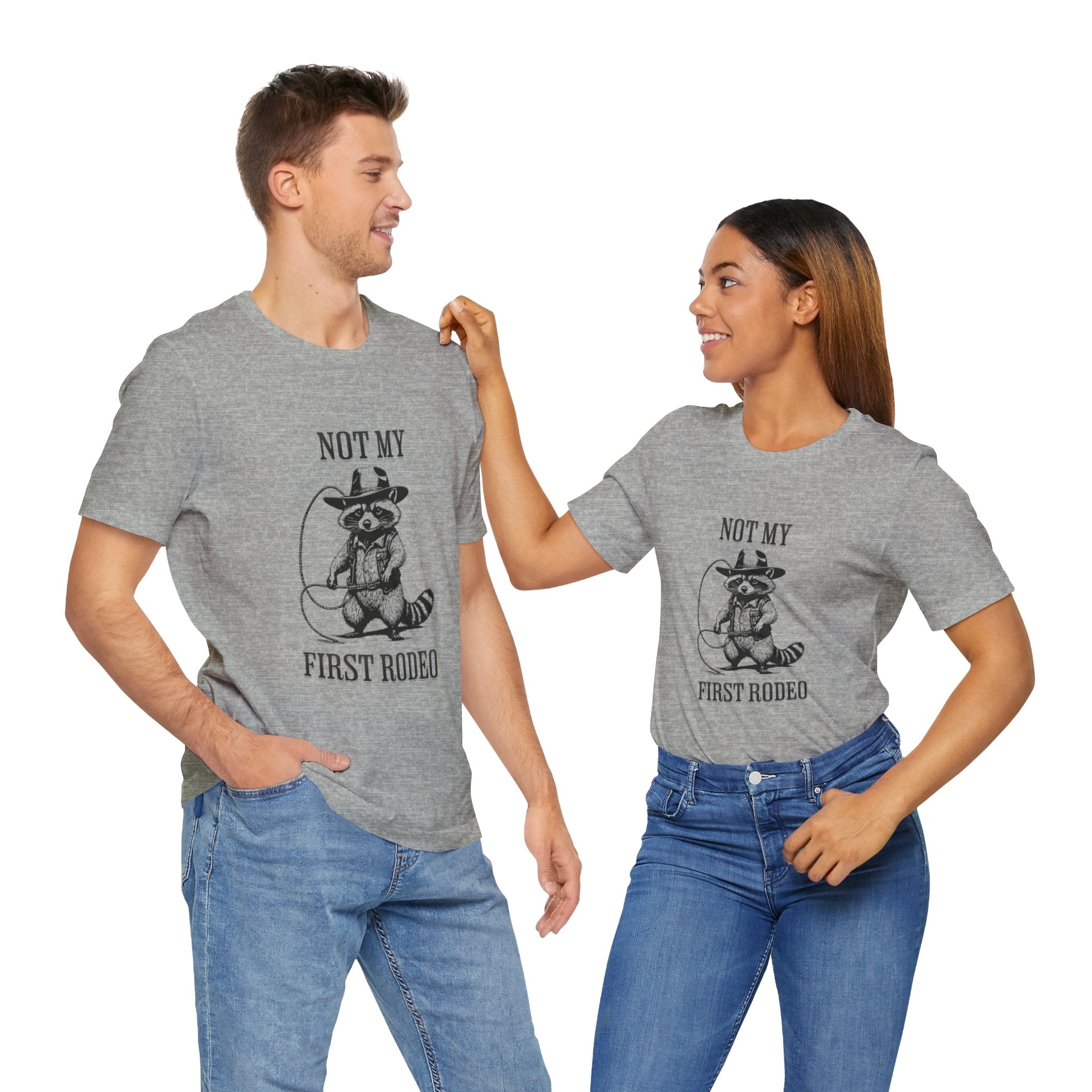 Funny Western Graphic Cotton Tee - Not My First Rodeo Cowboy Raccoon Shirt | Cute Quirky Country Style T-Shirt for Rodeo Fans & Animal Lovers | Perfect for Rodeo Events, Country Concerts & Casual Wear