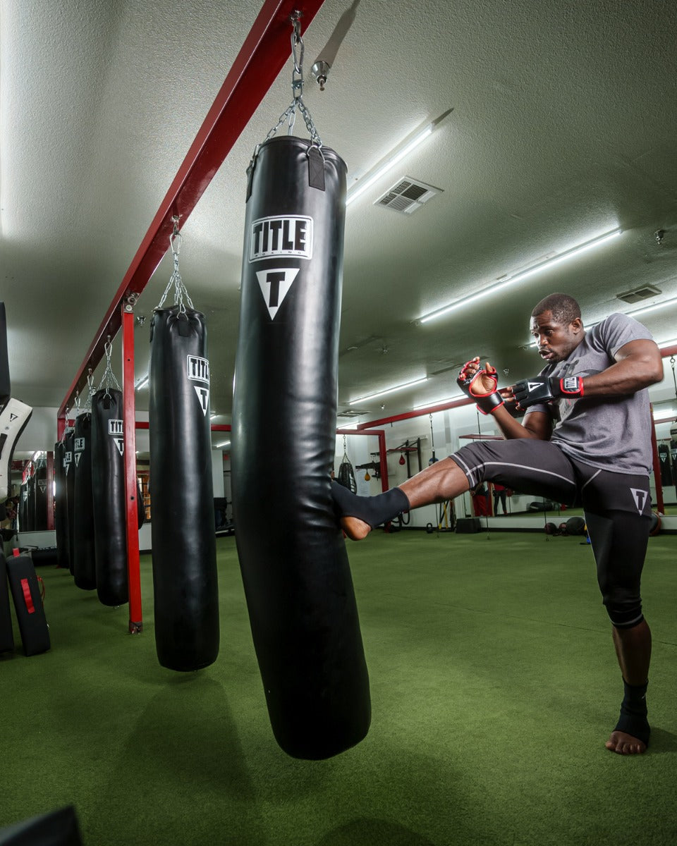 TITLE Boxing 100lb Synthetic Thai Heavy Punching Bag for MMA, Muay Thai & Kickboxing Training - Perfect for Home Gyms & Martial Arts Studios