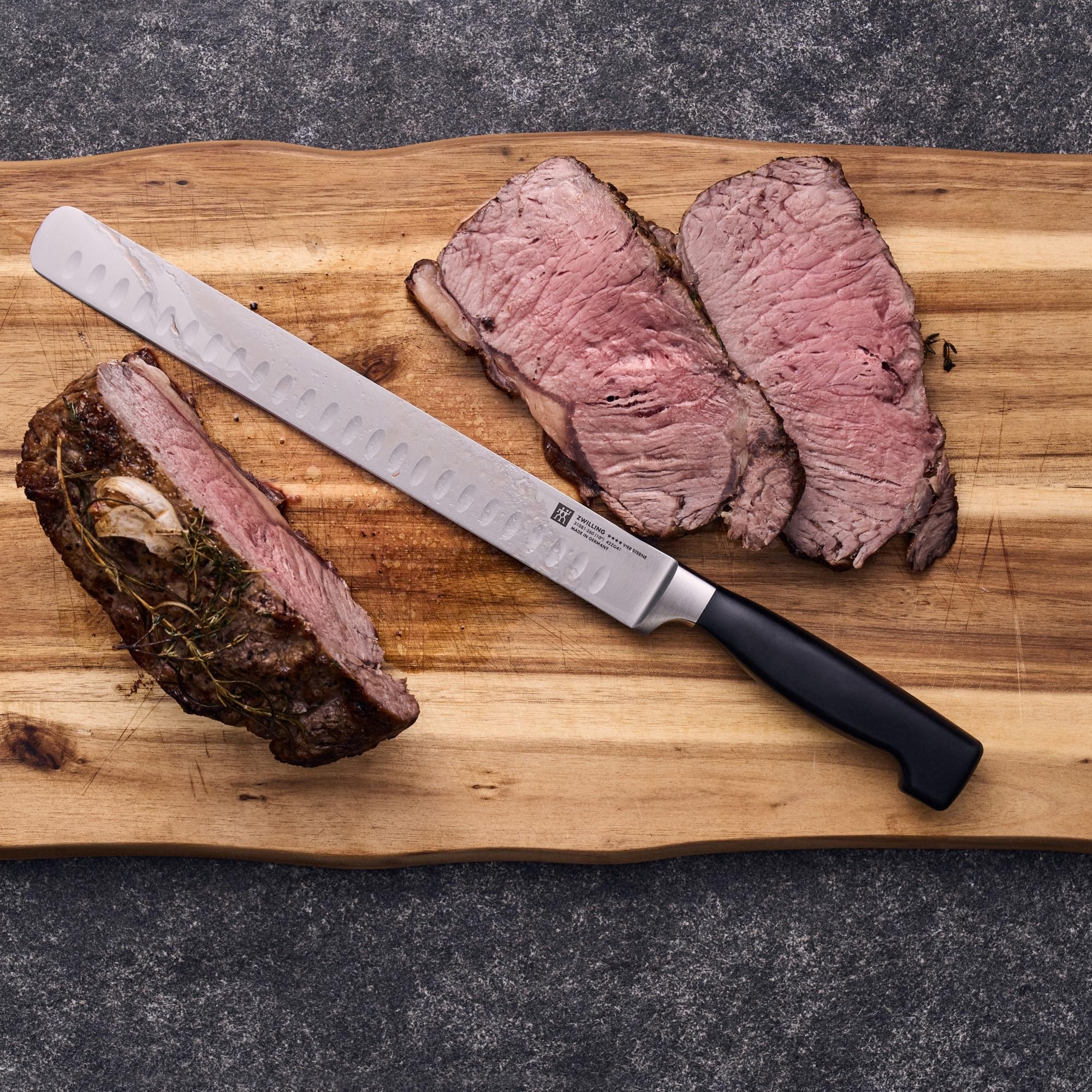 Zwilling J.A. Henckels Twin Four Star 10-Inch High-Carbon Stainless Steel Granton Edge Roast Beef Slicer Knife - Professional Kitchen Tool for Slicing Meats, Roasts, and Deli Meats
