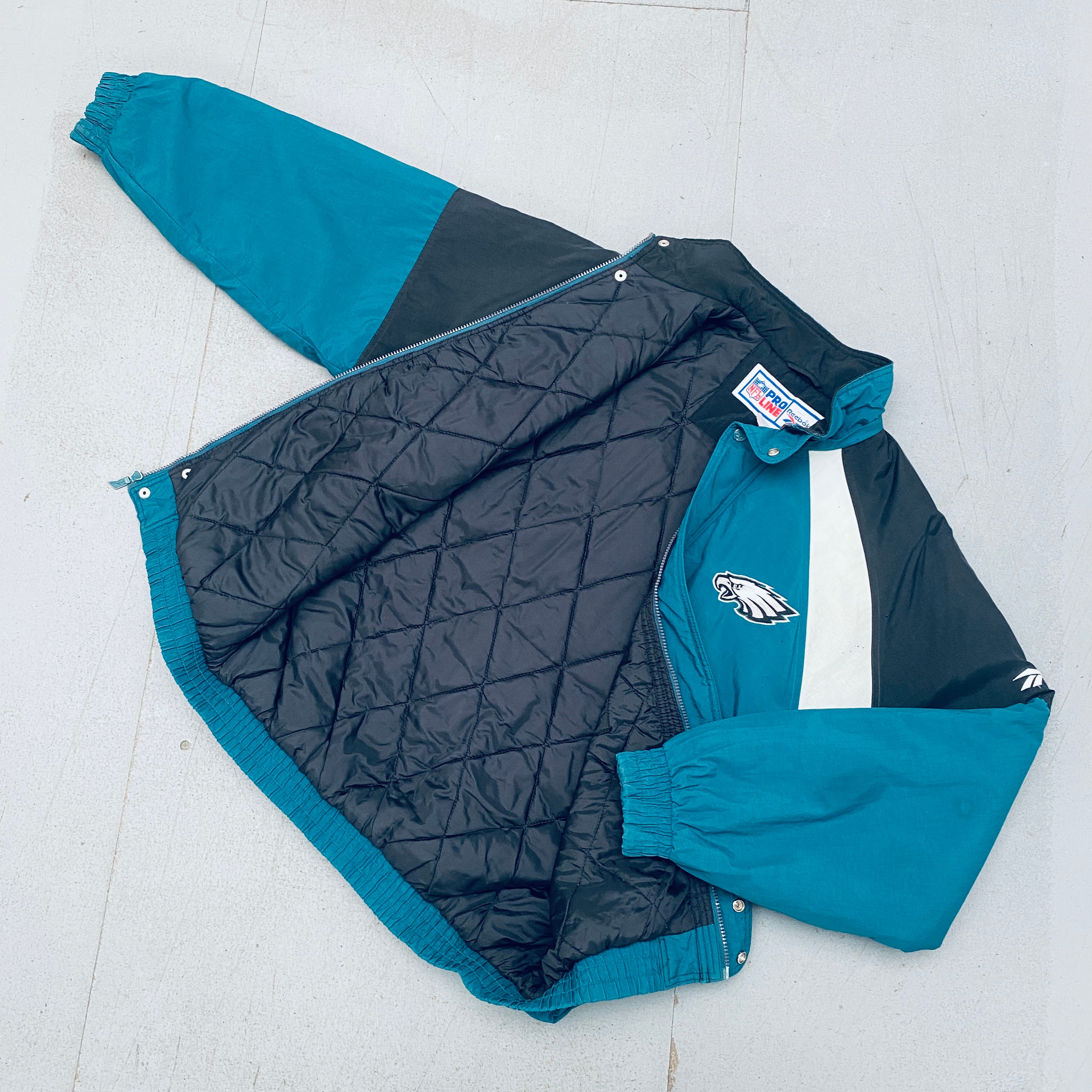 Philadelphia Eagles 1990s Reebok Reverse Spellout Full-Zip Proline Jacket for Men - Vintage NFL Football Fan Gear for Game Day & Casual Wear