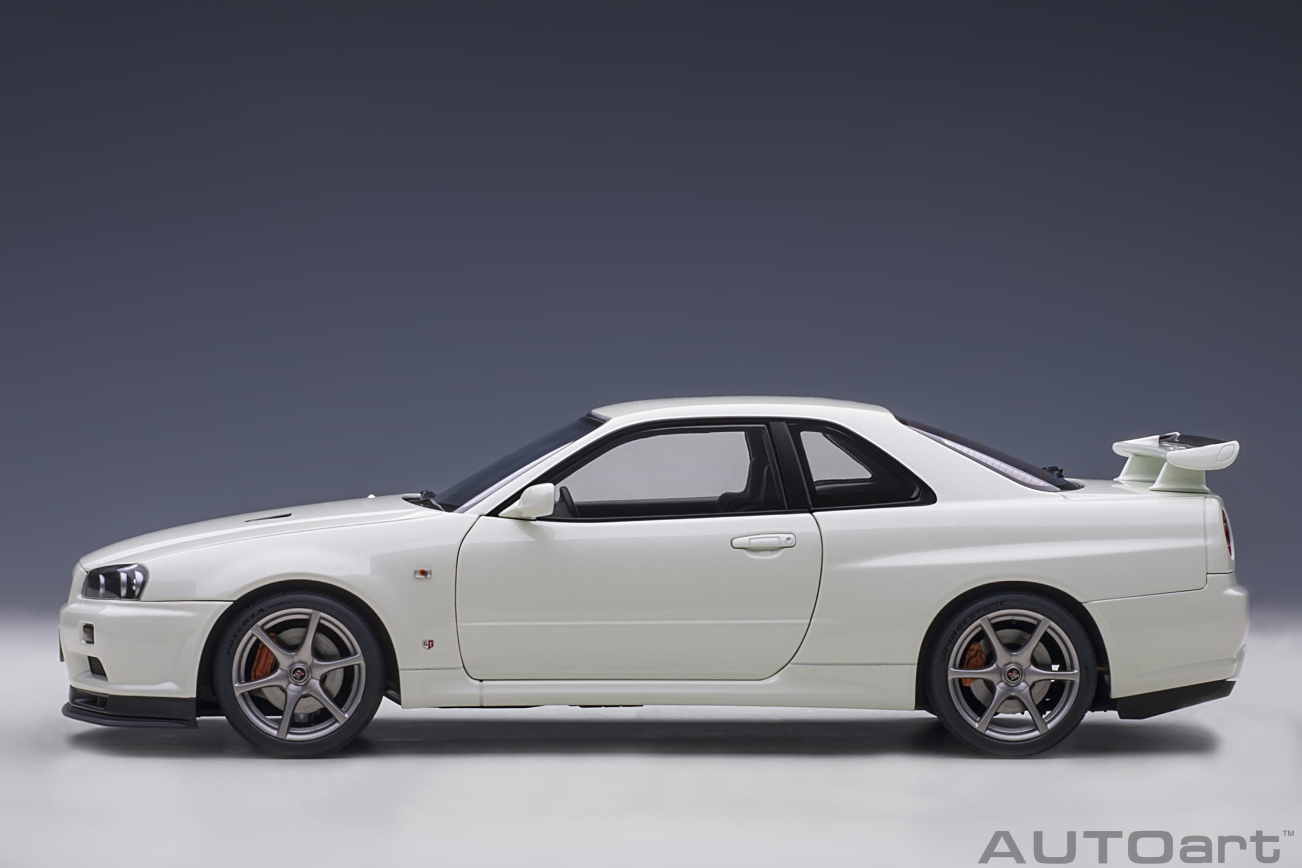 AUTOart 1:18 Scale Nissan Skyline GT-R R34 V-Spec II Diecast Model Car - White Pearl Finish | Collectible Display & Racing Enthusiast Gift