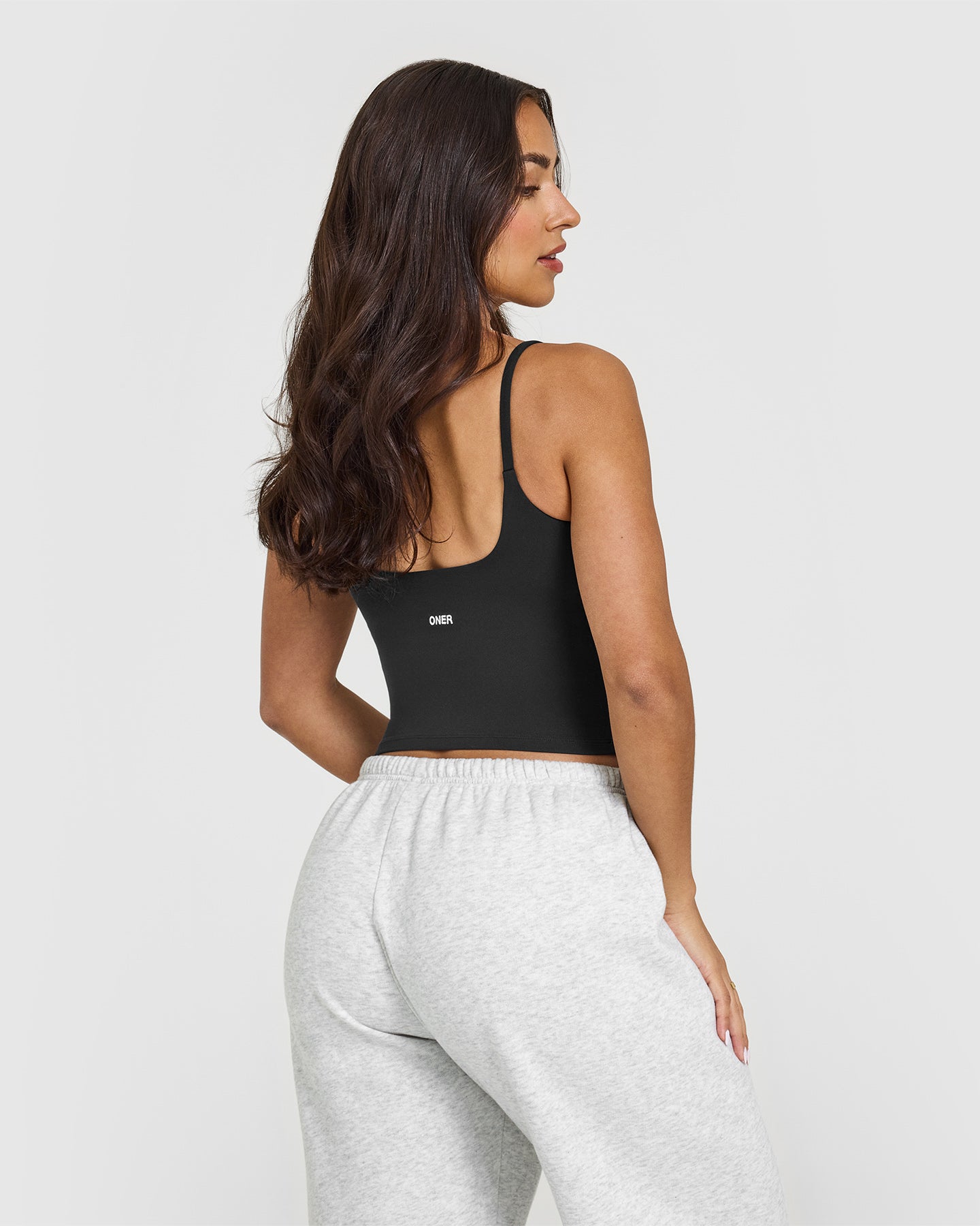 SoftMotion™ Strappy Mid Vest with Built-in Bra Shelf - Soft Black | Seamless Comfort for Yoga, Workouts & Lounge Wear