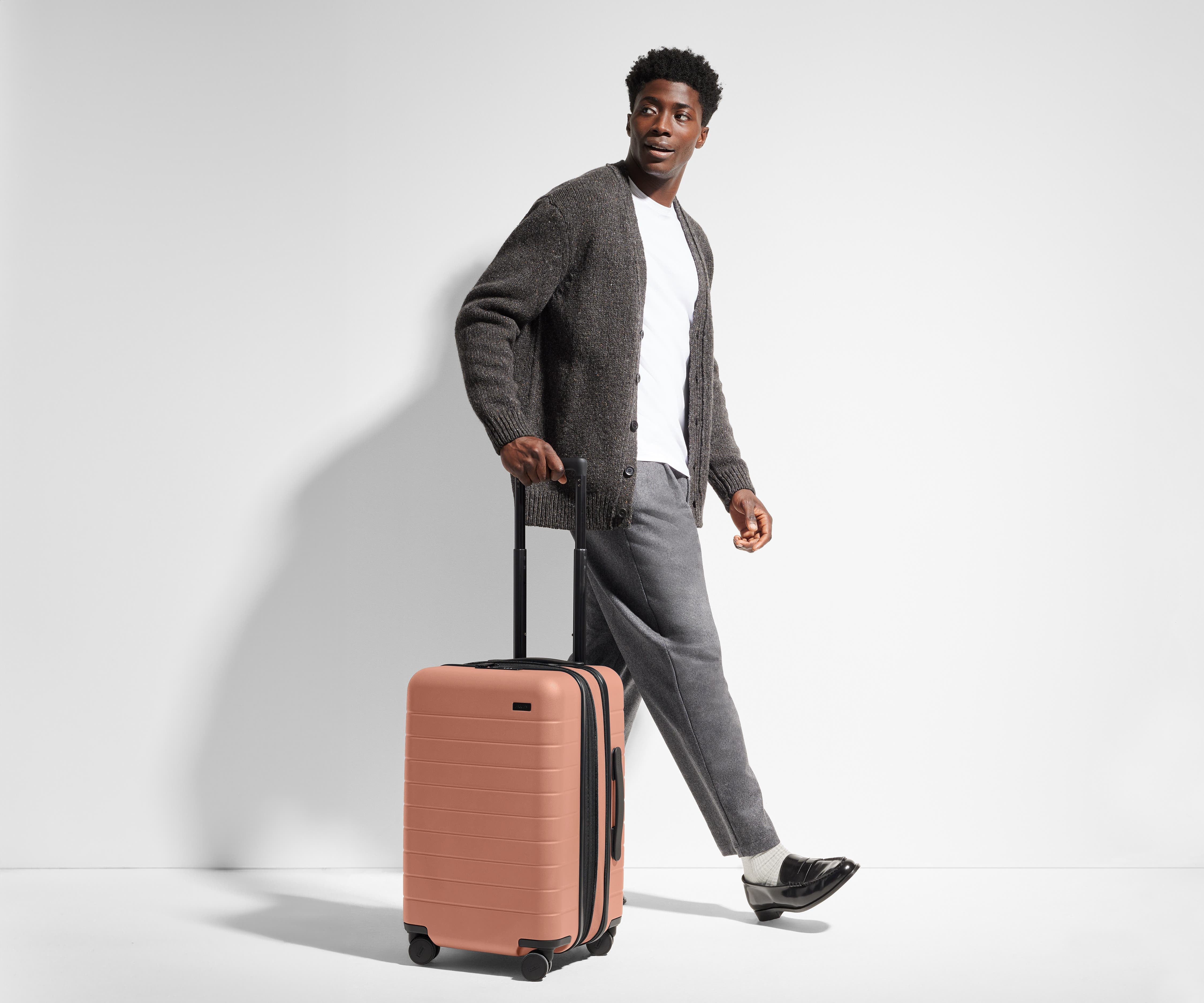 The Carry On Flex in Clay Pink - Lightweight Expandable Luggage for Travel, Business Trips & Weekend Getaways