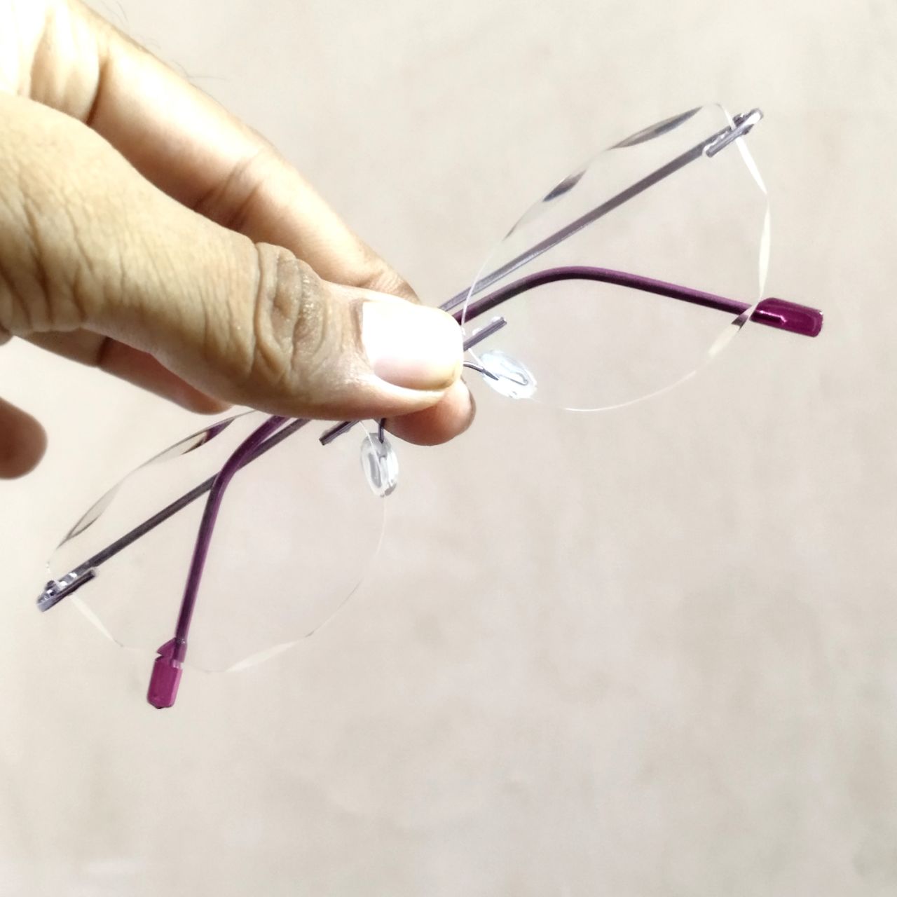 Stylish Purple Cat Eye Rimless Glasses with Diamond Cut Edges - Trendy Women's Fashion Eyewear for Work, Party & Everyday Wear