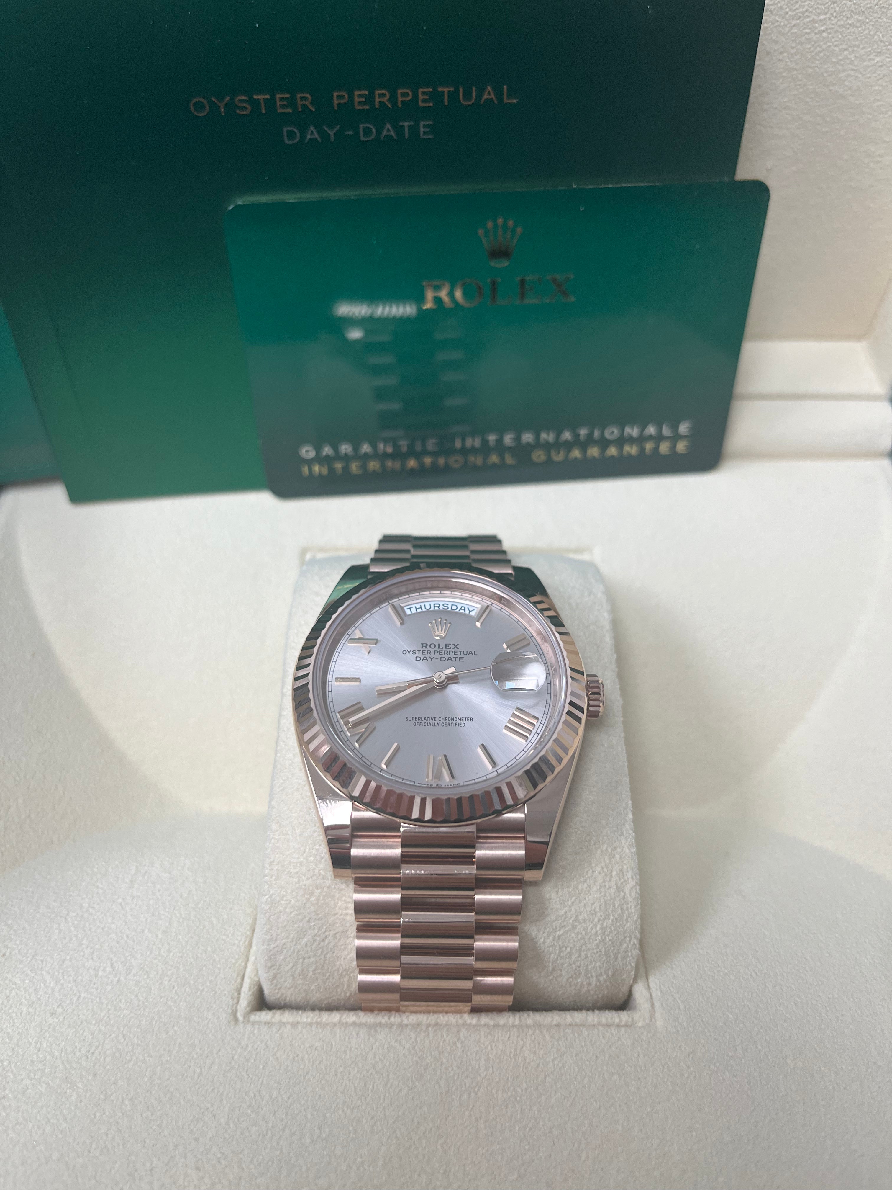 Rolex Day Date 40mm Rose Gold Watch with Sundust Roman Dial & Fluted Bezel (Ref #228235) - Luxury Dress Watch for Business & Formal Occasions