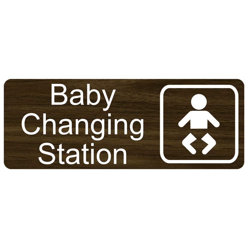 ComplianceSigns.com Baby Changing Station Engraved Sign with Symbol - 8x3 Inch White on Walnut Plastic for Restrooms & Public Bathrooms | ADA Compliant Nursery Changing Table Sign for Daycares, Hospitals & Family Restrooms
