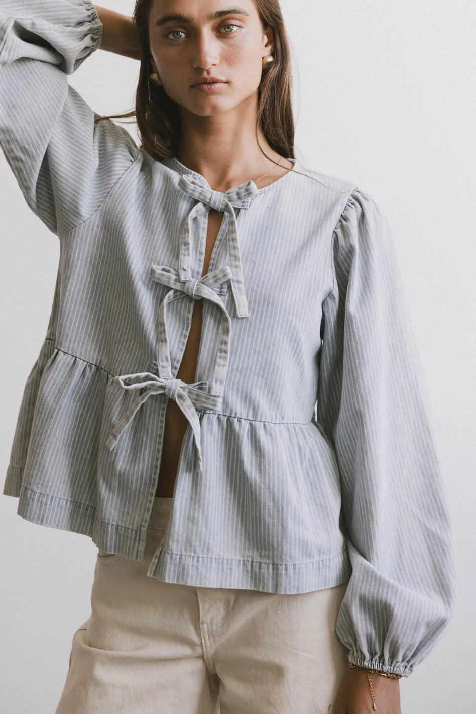 Elegant Maggie Peplum Tie Blouse in Light Wash - Women's Casual & Office Wear - Perfect for Work, Dates & Special Occasions