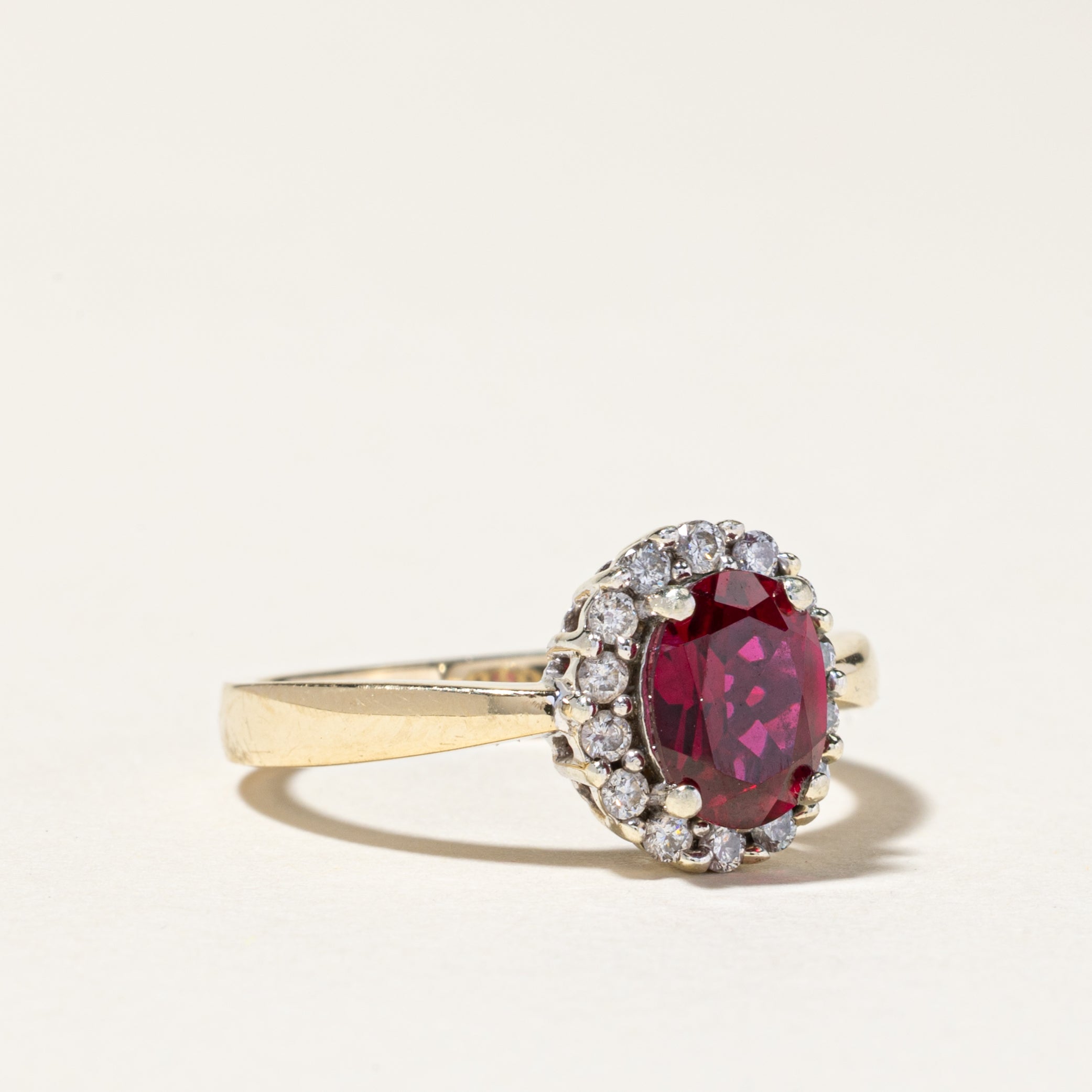10K White Gold Synthetic Ruby and Diamond Halo Engagement Ring - 1.50ct Oval Ruby with 0.22ctw Diamond Accents - Size 7.5 - Perfect for Anniversary Gifts, Valentine's Day or Bridal Jewelry