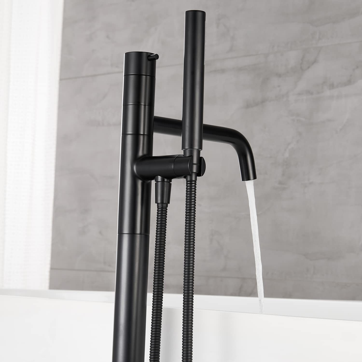 Freestanding Bathtub Faucet - Black Floor Mount Brass Single Handle Tub Filler with Hand Shower for Modern Bathroom | Perfect for Spa-Like Relaxation & Luxury Bathing Experience