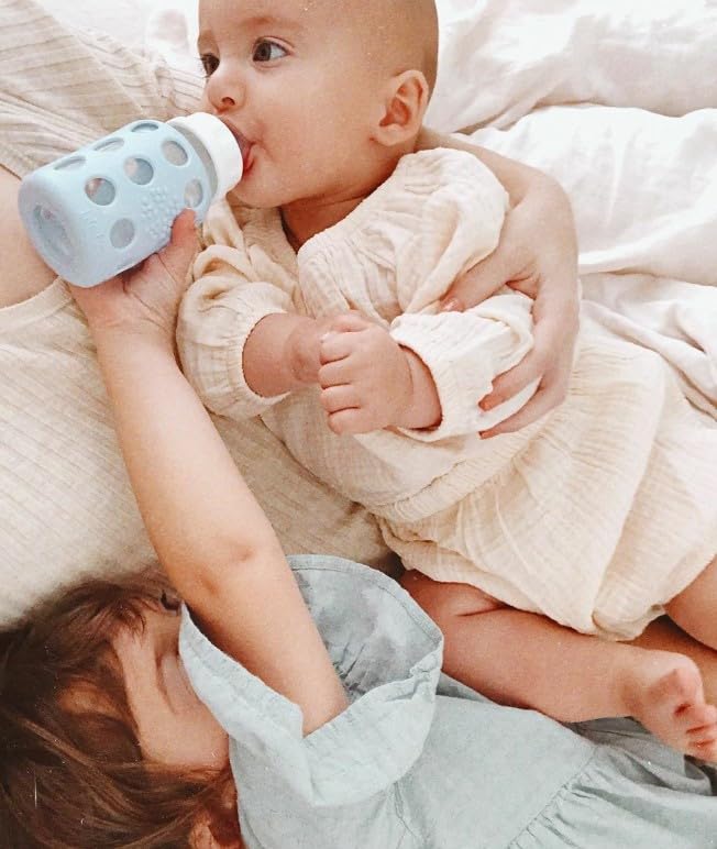 Lifactory 4oz Glass Baby Bottles with Silicone Sleeve - 2 Pack (Pink & Sky Blue) | BPA-Free, Microwave & Dishwasher Safe | Perfect for Newborns, Infants & Toddlers | Ideal for Breastfeeding, Formula Feeding & On-the-Go Use
