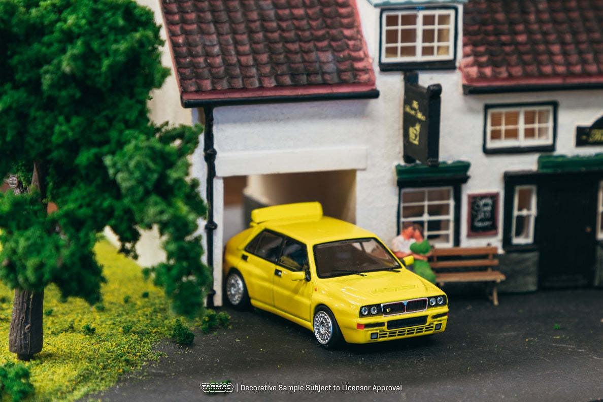 Tarmac Works 1:64 Scale Lancia Delta HF Integrale Diecast Model Car - Giallo Ginestra Yellow | Collectible Miniature Vehicle for Display, Racing Enthusiasts & Diecast Collectors