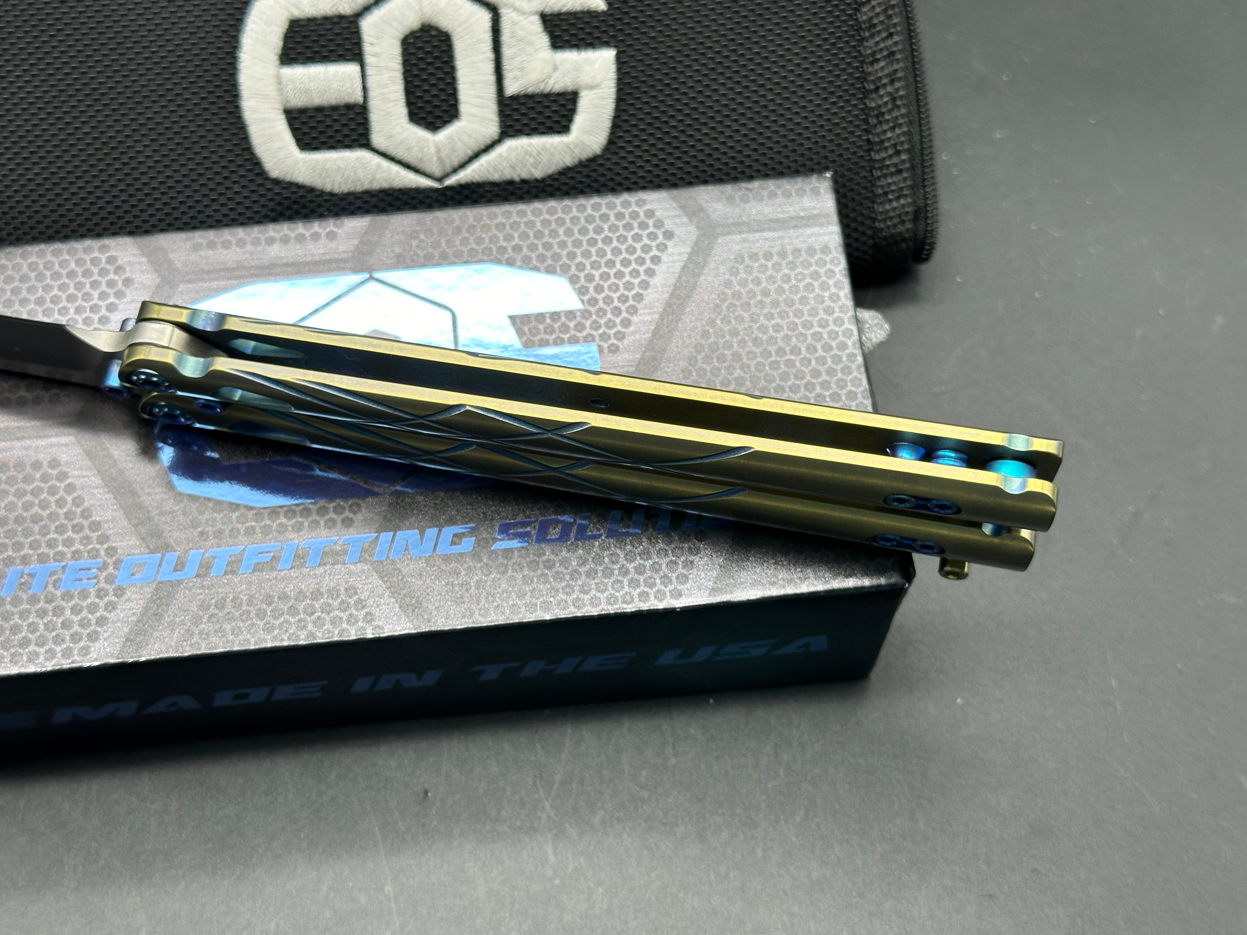 Premium EOS Villian Balisong Butterfly Knife - Gold Titanium Handles, Blue Latch Hardware, Recurve Tanto Blade in Sasha Satin CPM S30V Steel | Perfect for Collectors, EDC Carry & Tactical Enthusiasts