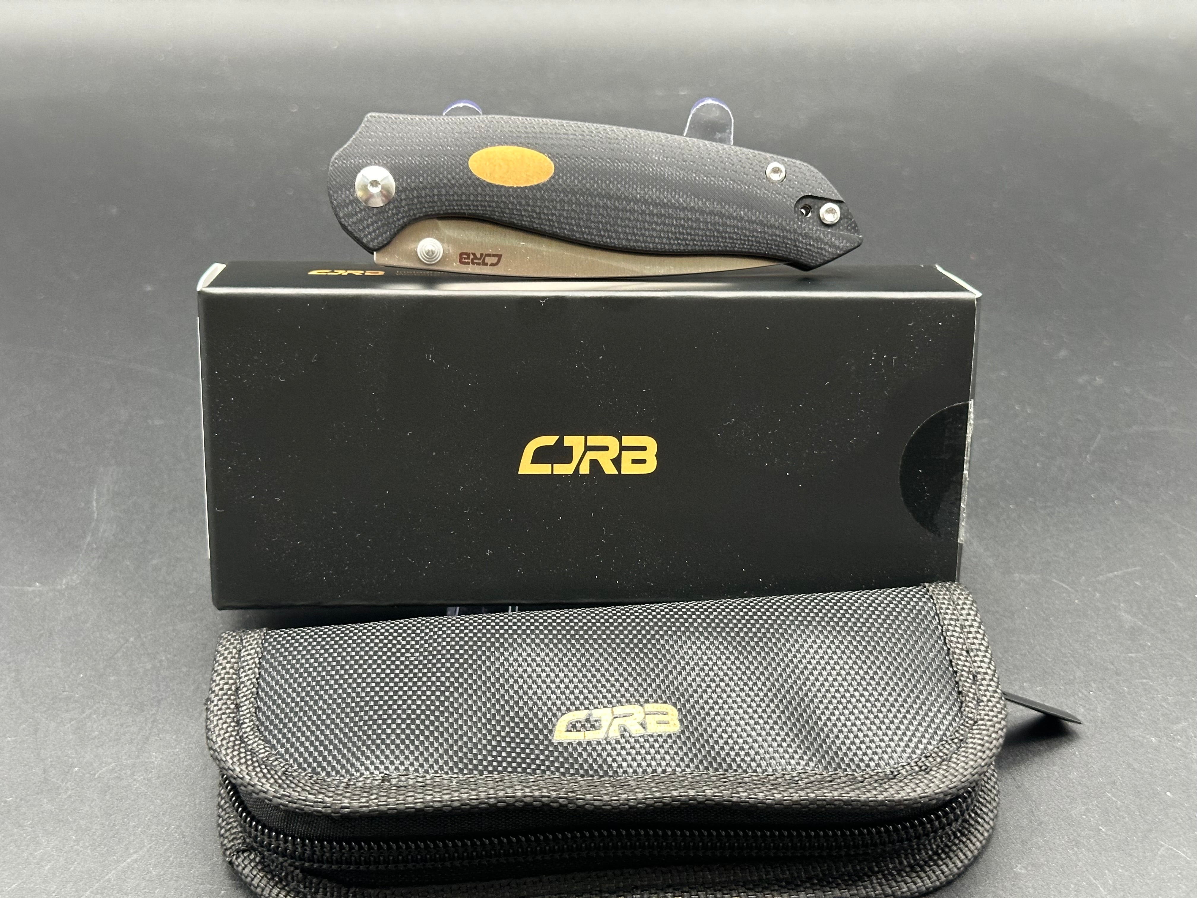 CJRB AES Folding Knife - Black G10 & Brass Handle, AR-RPM9 Steel, Drop Point Plain Edge, Sand Polish Finish - EDC, Camping, Outdoor Survival