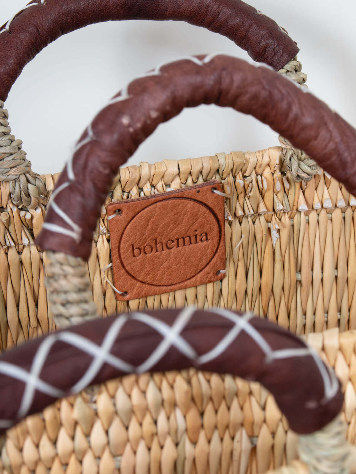 Handwoven Reed Basket with Genuine Leather Handles - Natural Woven Storage Bin for Home Decor, Laundry, or Picnic Basket - Perfect for Organizing Blankets, Toys, and More