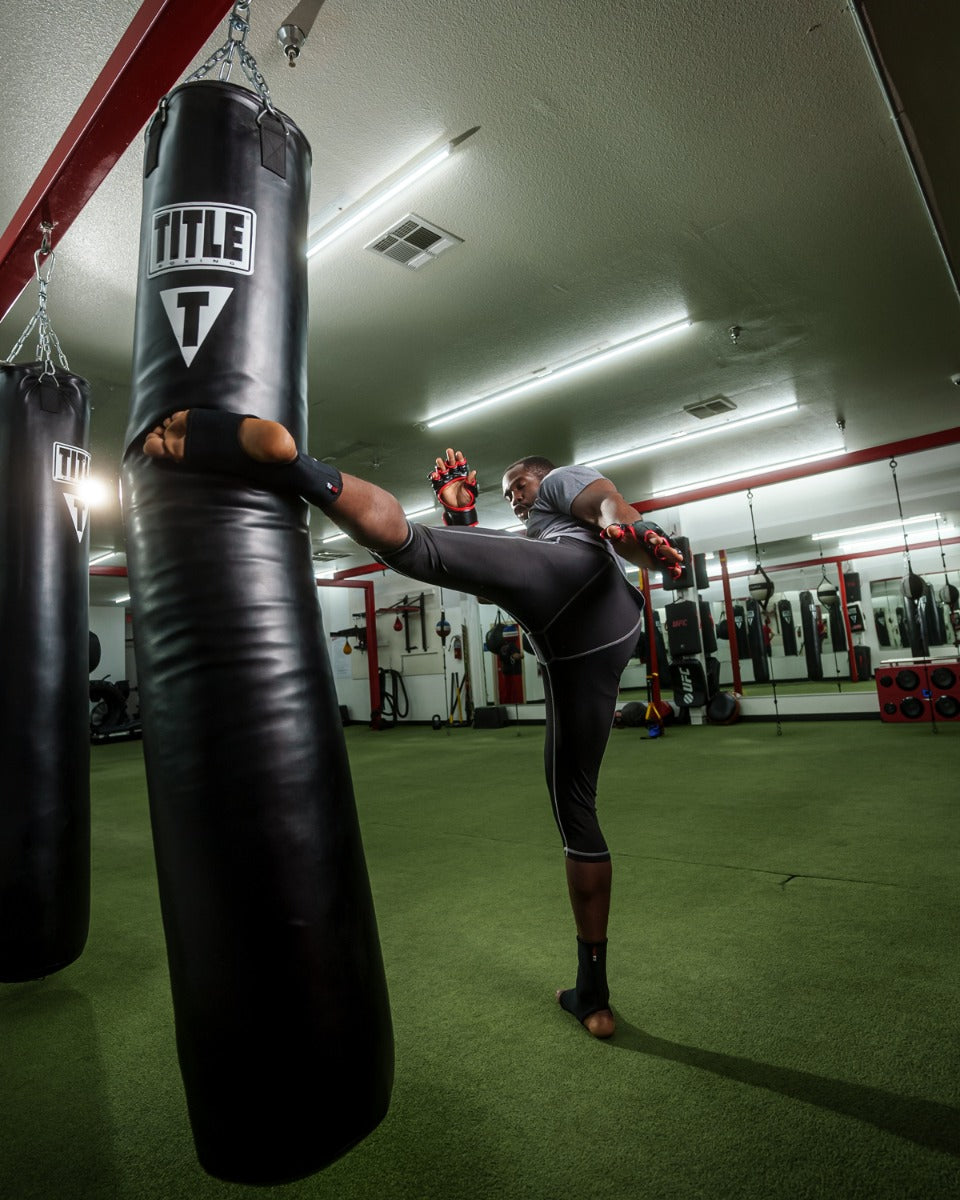 TITLE Boxing 100lb Synthetic Thai Heavy Punching Bag for MMA, Muay Thai & Kickboxing Training - Perfect for Home Gyms & Martial Arts Studios