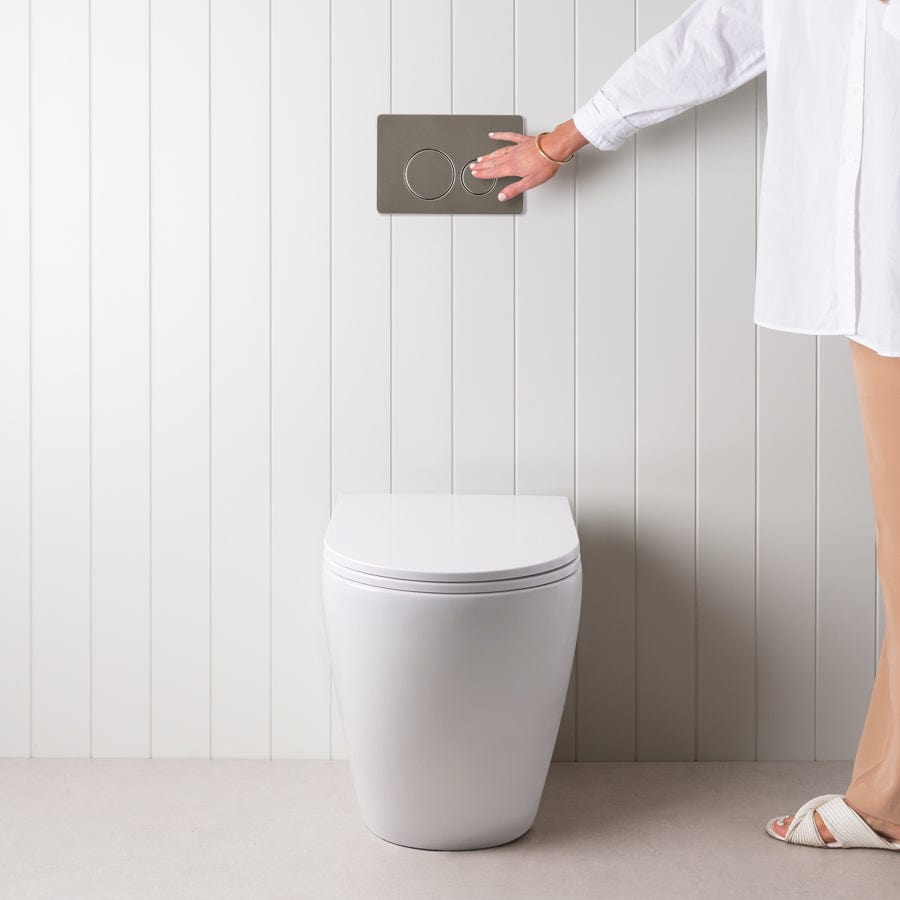 Wall-Mounted Curved Toilet with Round Stainless Steel Flush Buttons - Space-Saving Modern Bathroom Design for Small Spaces & Contemporary Homes