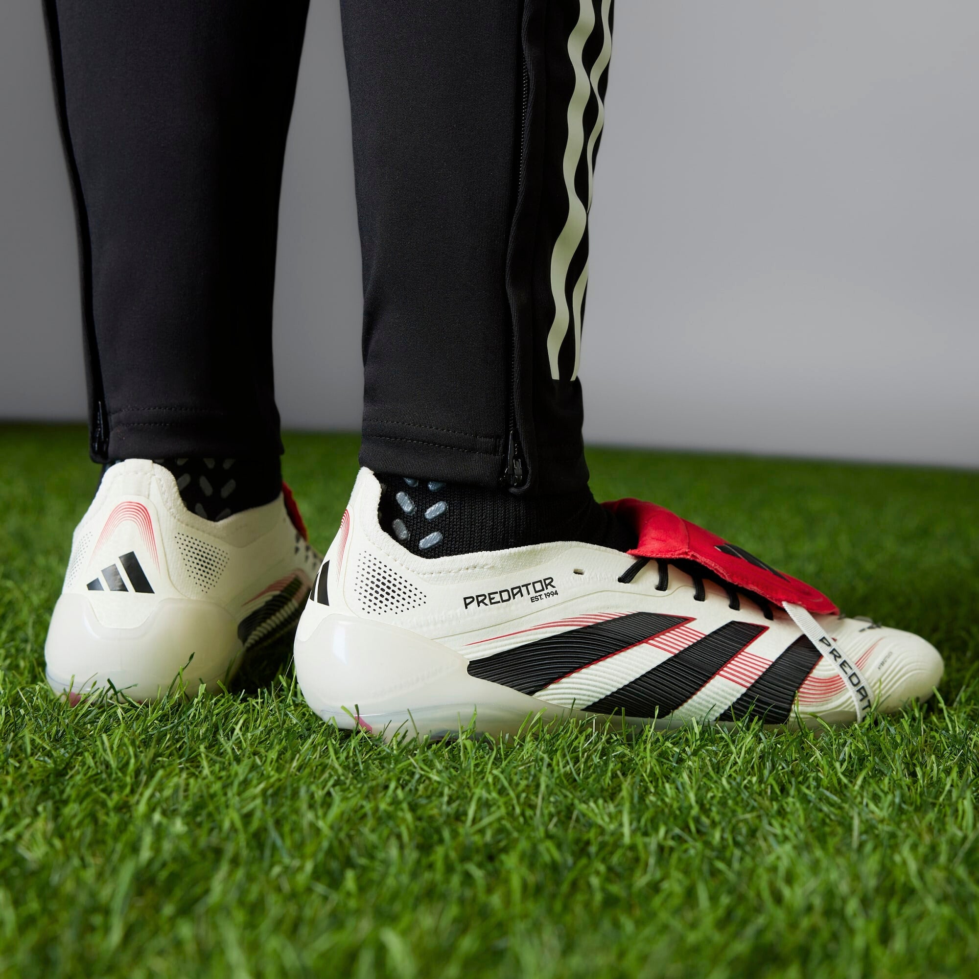 **adidas Predator Elite Fold Over Tongue Soccer Cleats - Lightweight & Comfortable for Football Training & Matches**    *(Use Case: Perfect for competitive soccer players seeking superior traction and support on firm ground surfaces.)*