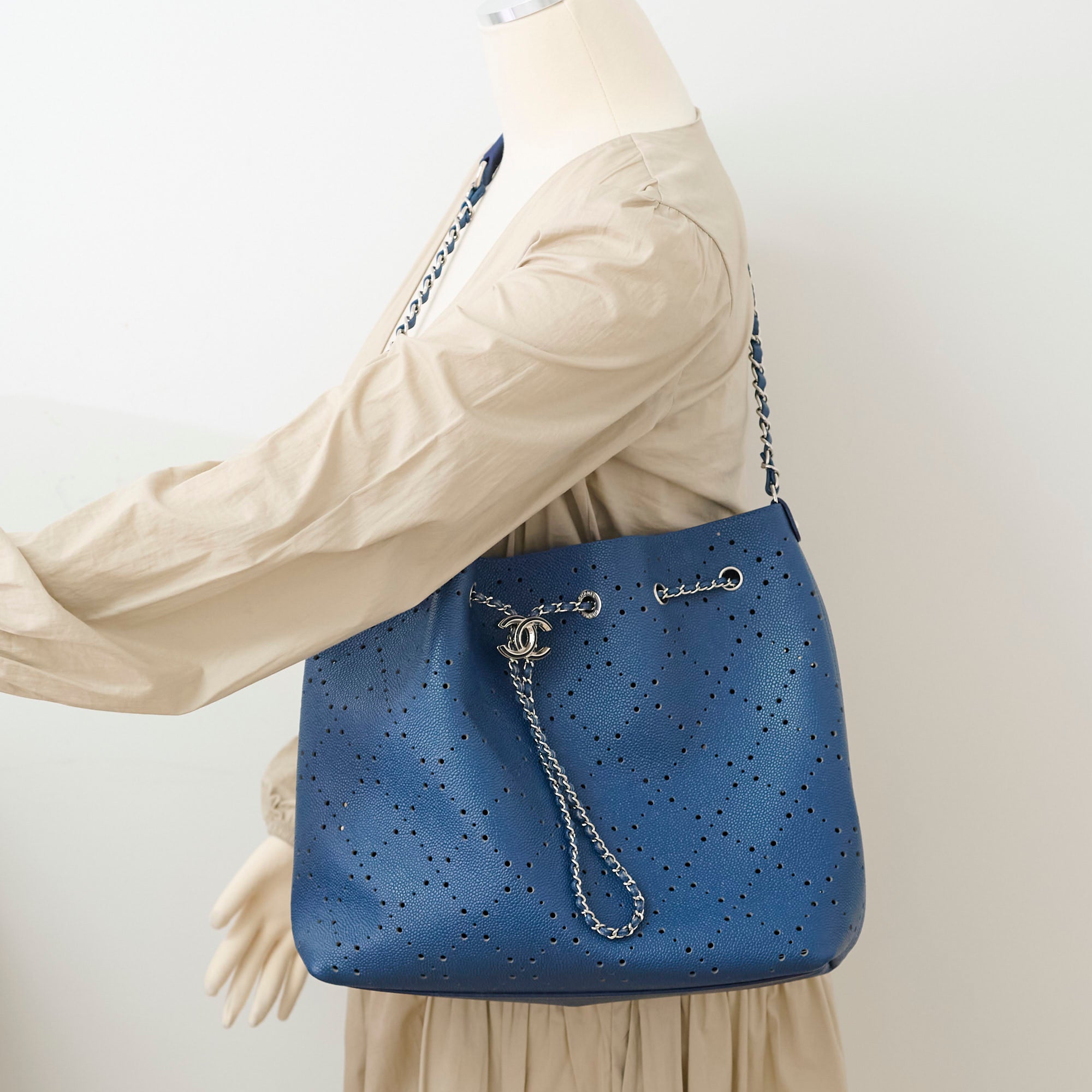 Chanel Perforated Drawstring Bucket Bag in Blue | Luxury Designer Handbag for Women | Perfect for Casual Outings & Beach Vacations