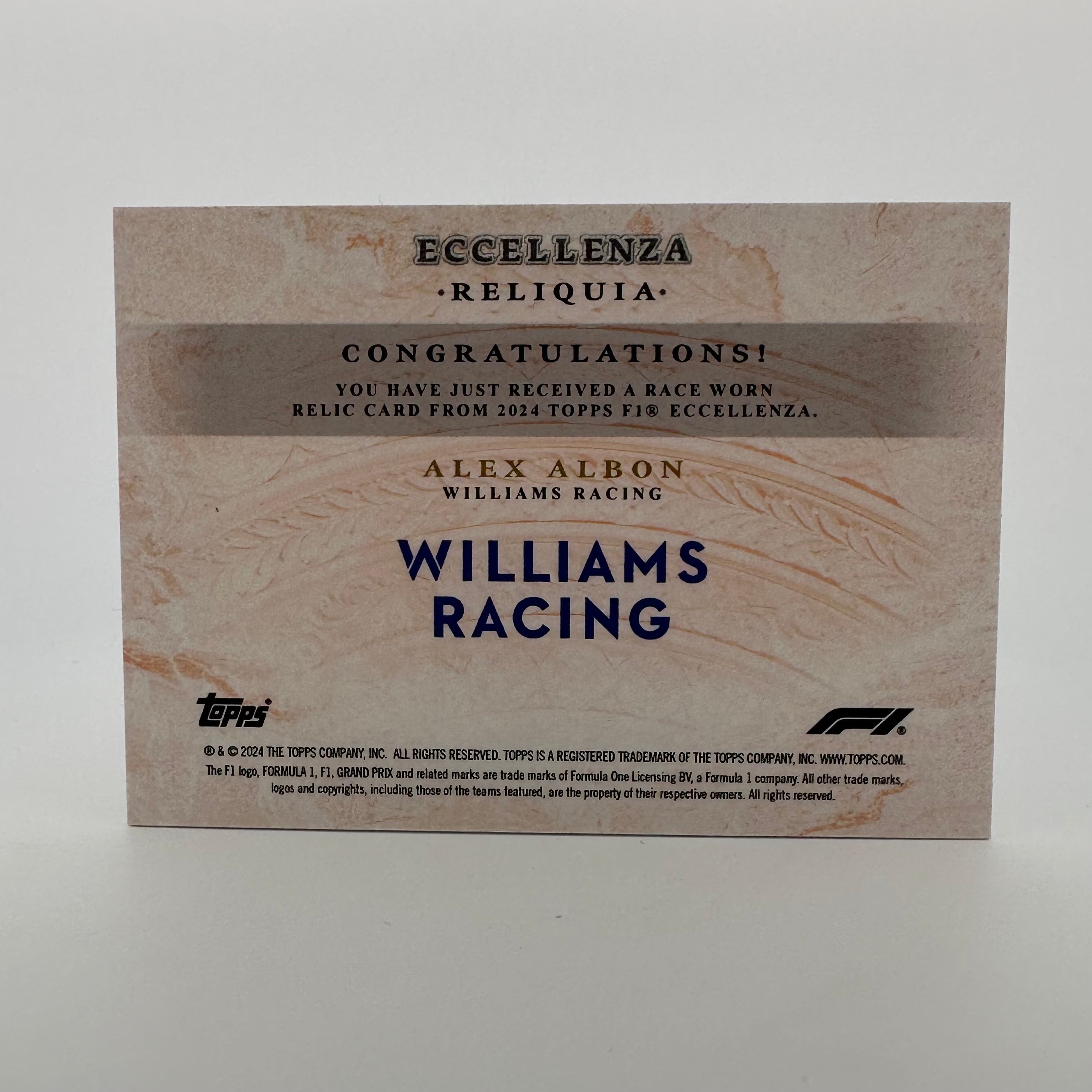 2024 Topps Eccellenza F1 Alex Albon Reliqua Orange Racing Card - Perfect for F1 Collectors, Trading, and Display