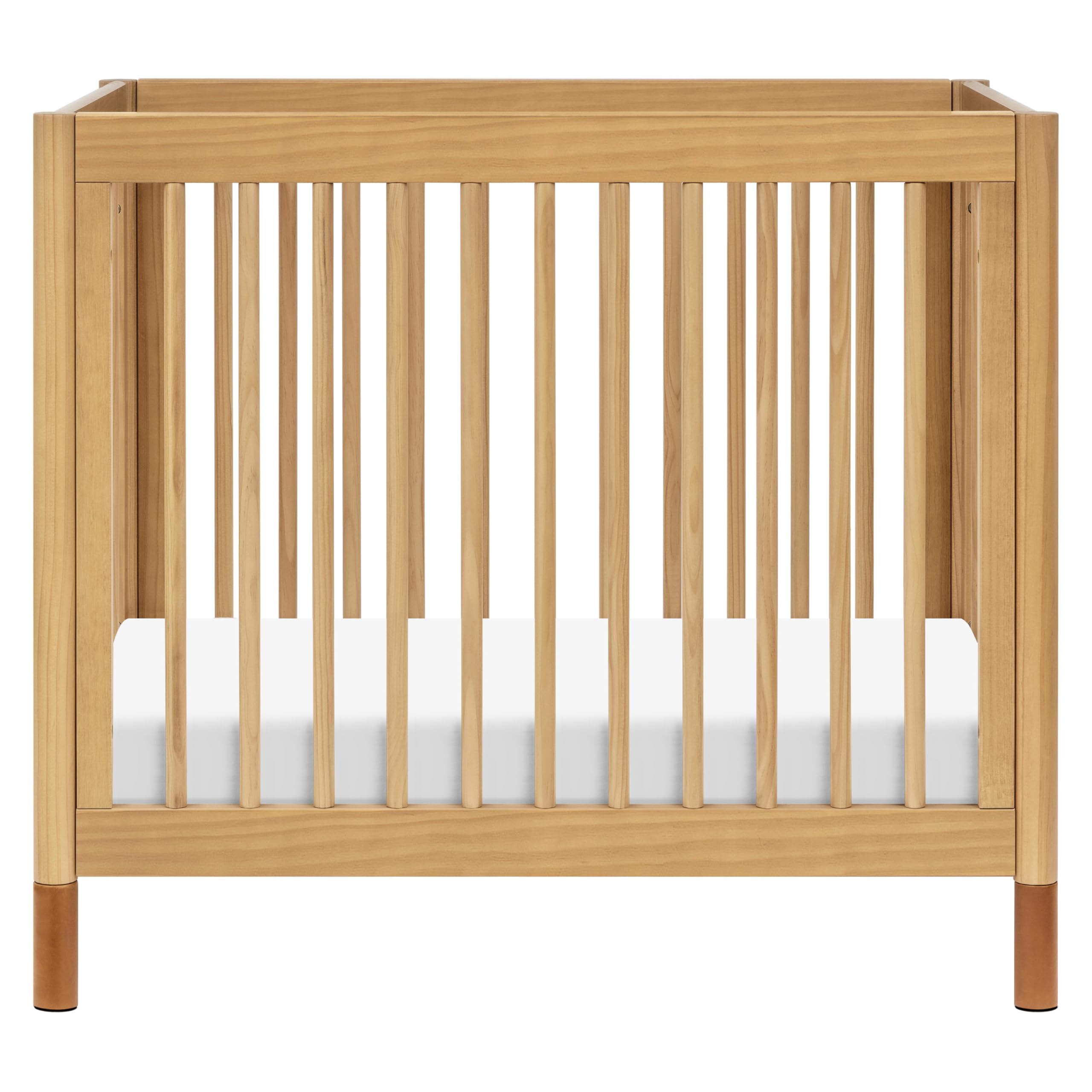 Babyletto Gelato 4-in-1 Convertible Mini Crib - GREENGUARD Gold Certified Wooden Toddler Bed, Daybed & Twin Bed with 4 Adjustable Heights - Space-Saving Nursery Furniture for Small Rooms - Honey Finish with Vegan Tan Leather - Ideal for Newborns, Infants & Toddlers in Apartments or Shared Bedrooms