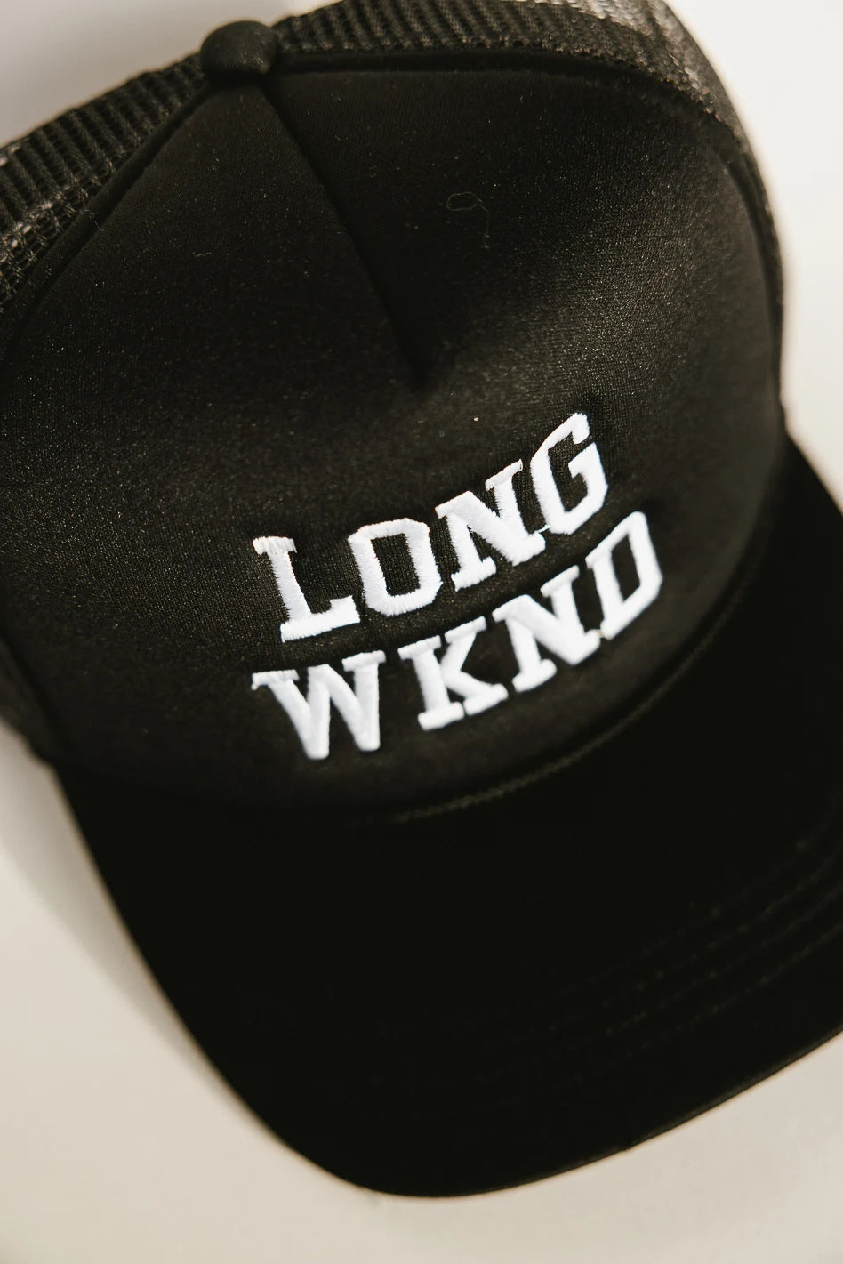 Long Weekend Trucker Hat in Black - Stylish & Comfortable Baseball Cap for Outdoor Activities, Travel, and Casual Wear