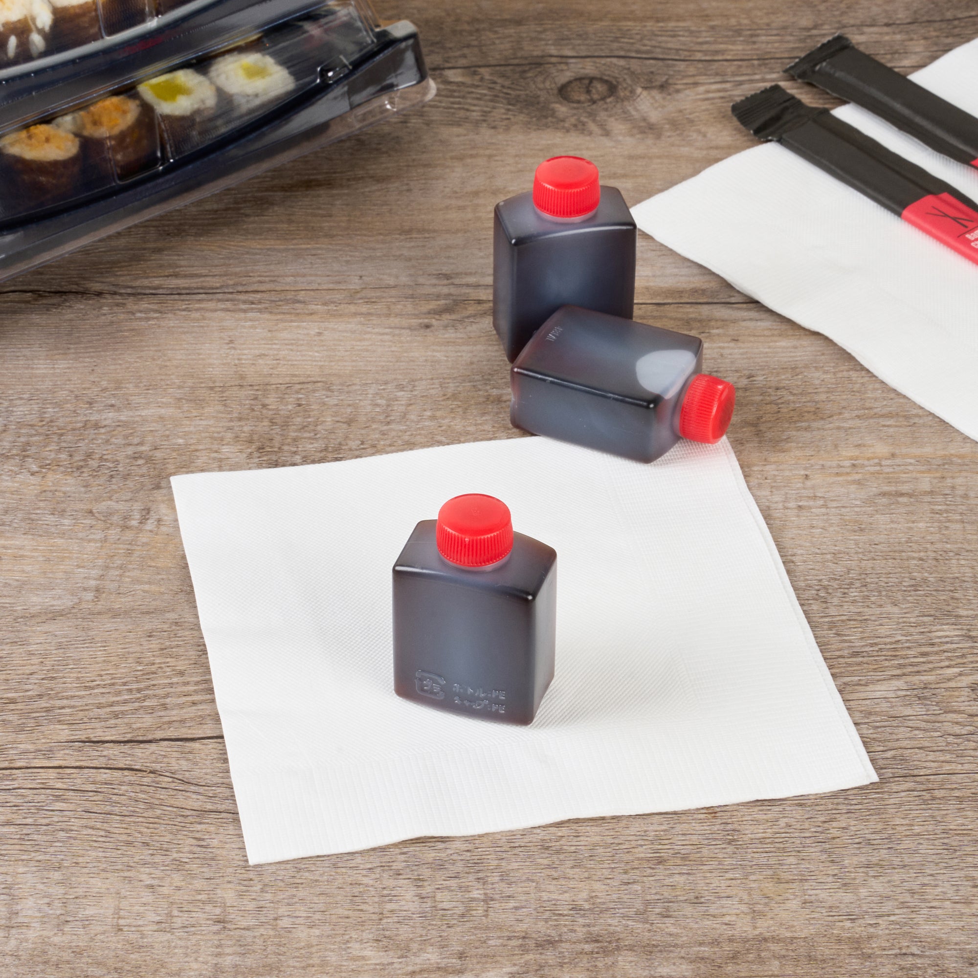 Bento Tek 2 oz Clear Plastic Soy Sauce Bottles with Red Caps - 1.5