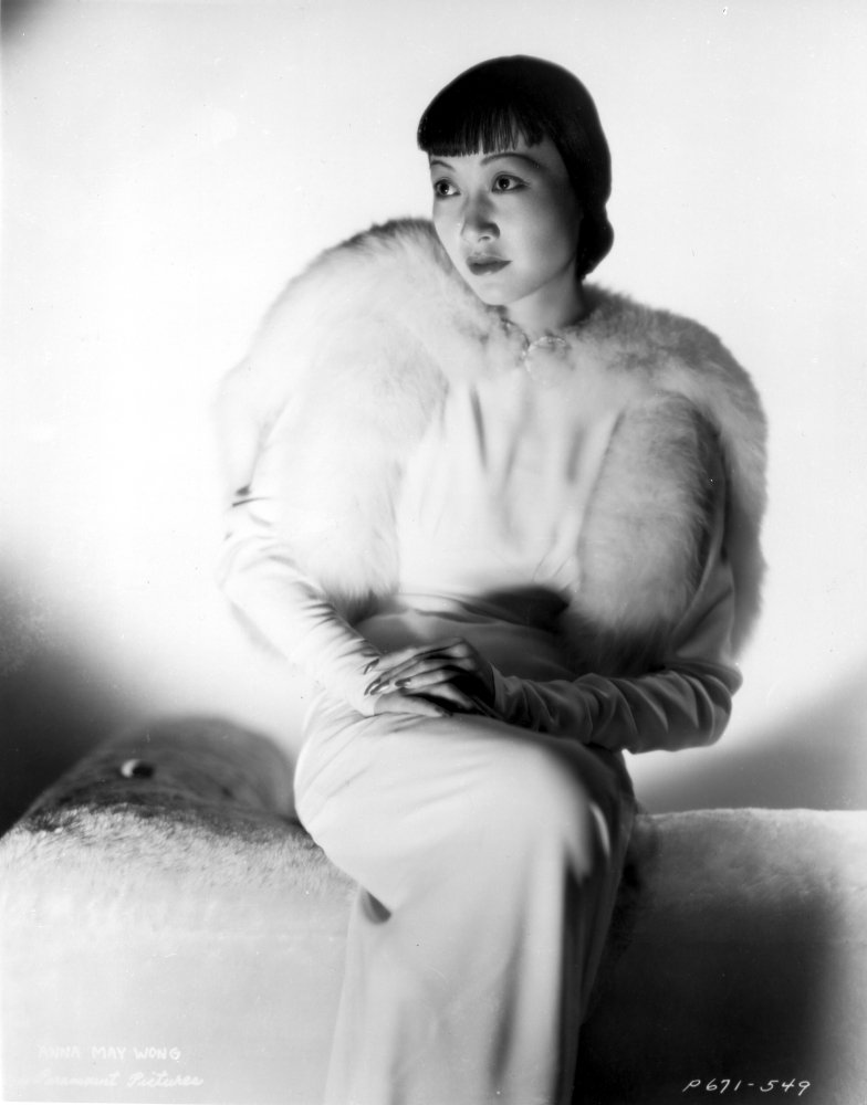 Anna Wong Sitting on Couch with Furry Blazer Photo Print - 8x10 Inch Wall Art Decor for Living Room, Bedroom & Office