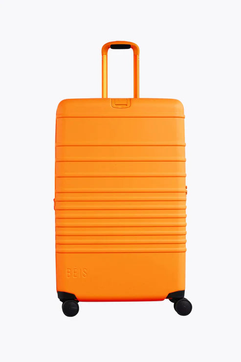 Large Check-In Roller Suitcase in Creamsicle - Spacious & Durable Travel Luggage for Airlines, Vacations & Business Trips
