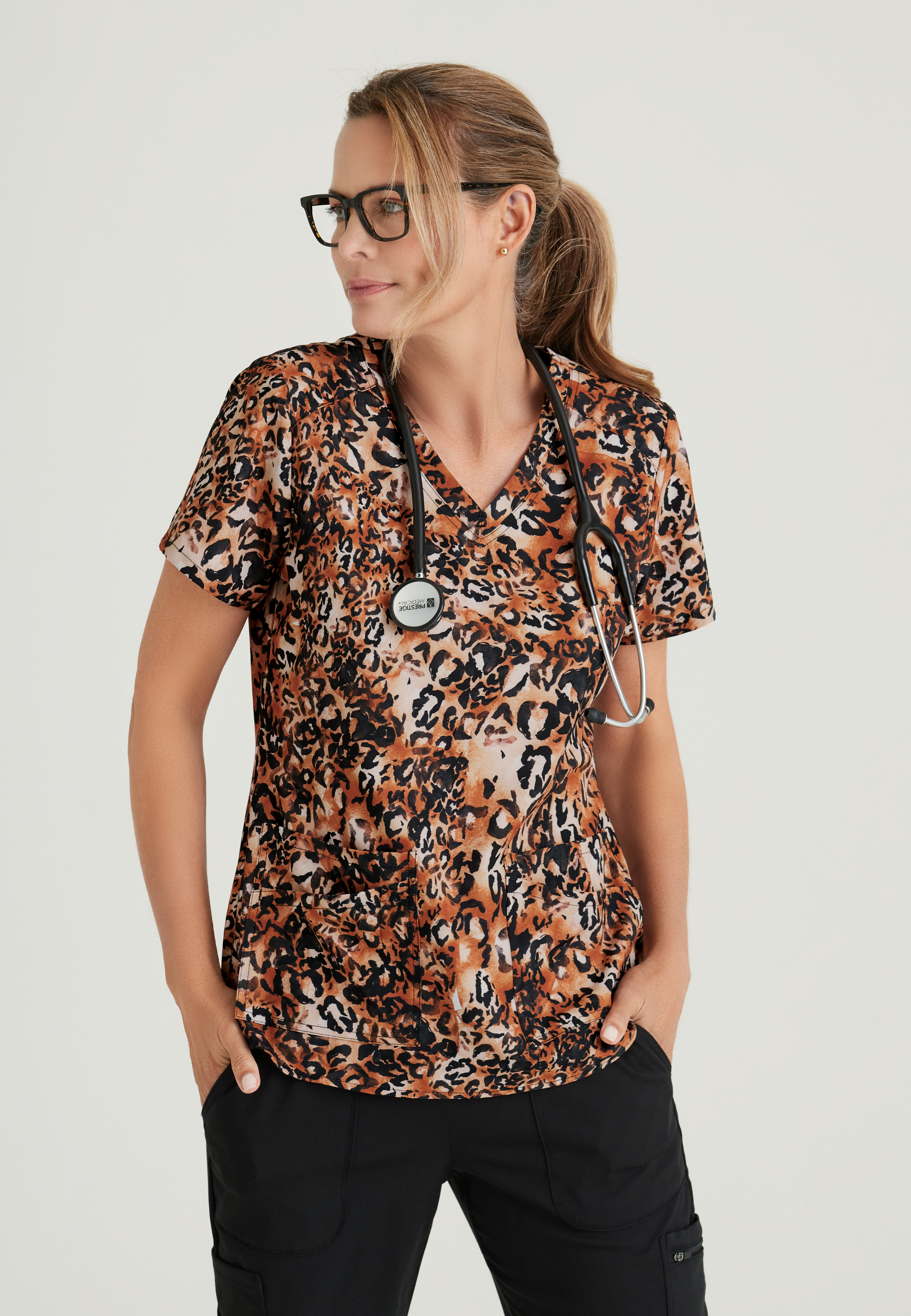 Women's Cheetah Print Scrub Top - Comfortable Medical Uniform for Nurses & Healthcare Professionals - Perfect for Hospital Shifts, Clinics & Healthcare Work Environments