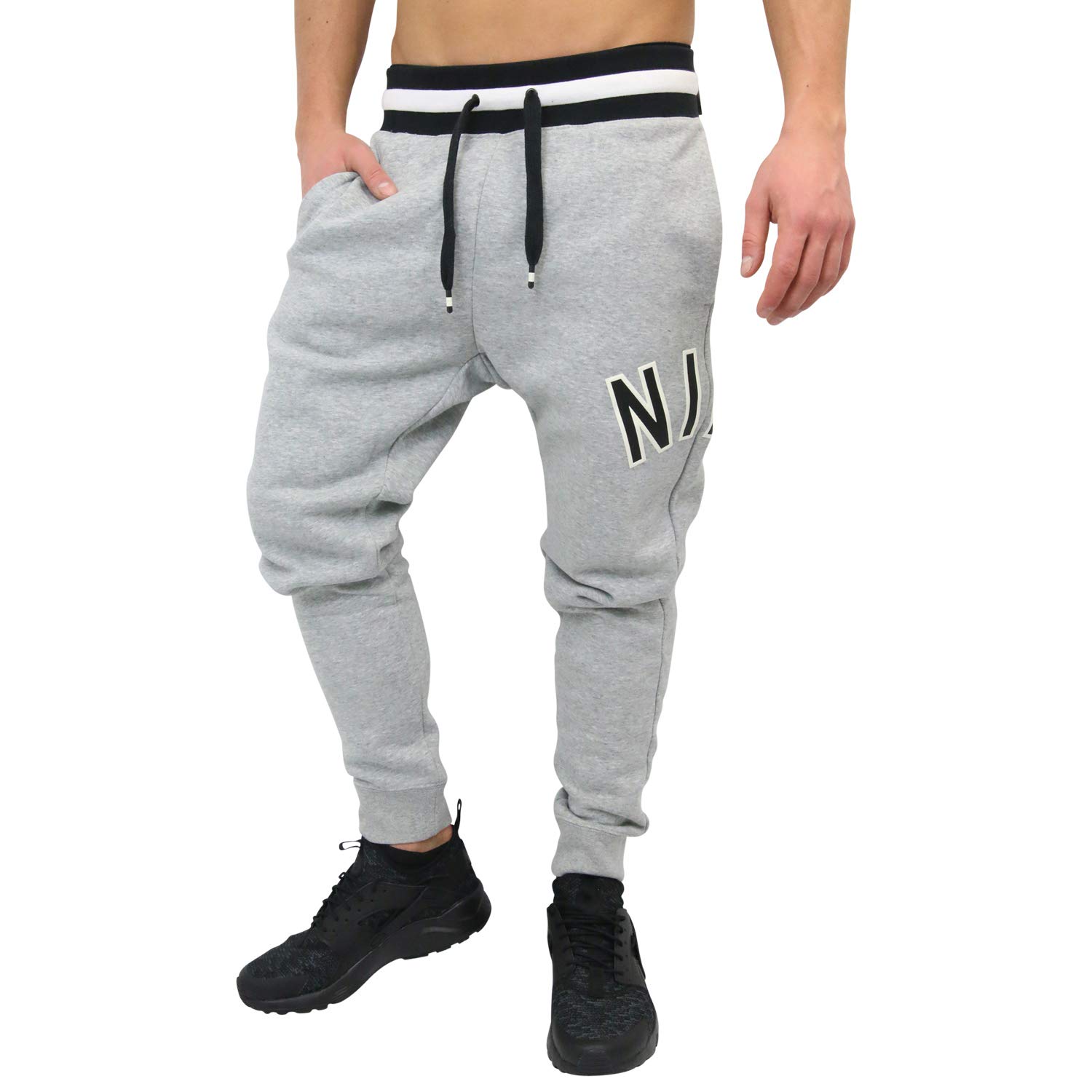 Nike Air Fleece Pants for Men & Women - Comfortable Athletic Joggers with Elastic Waistband - Perfect for Running, Gym Workouts & Lounge Wear