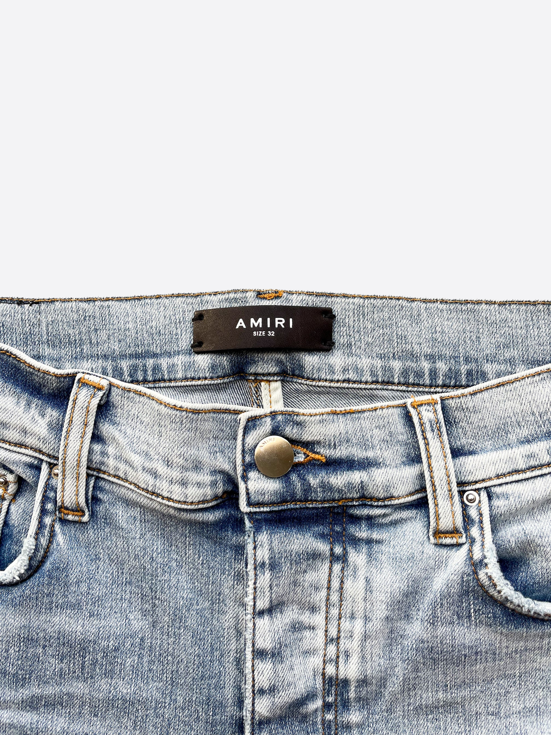 Amiri Playboy Blue Distressed Jeans for Men - Vintage Washed Denim Pants with Rabbit Logo | Perfect for Streetwear & Casual Outfits