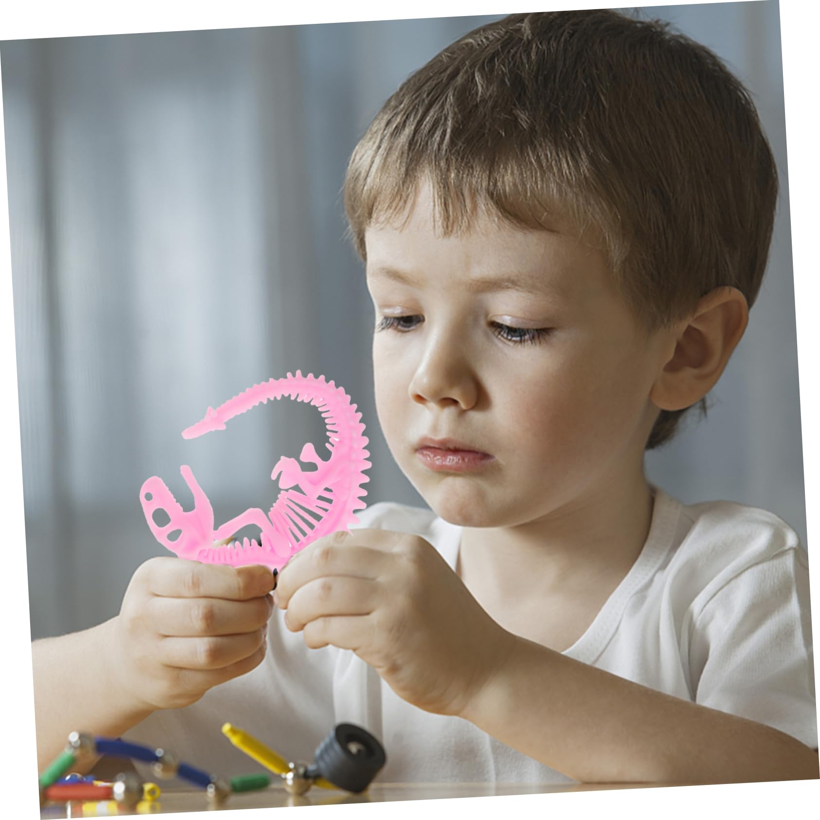 DIKACA 6-Pack Stretchy Fishbone Rope Toys - Dinosaur Pull String Fidget Toys for Kids, Sensory Stress Relief & Fun Playtime (Great for Classrooms, Birthday Gifts & Travel Activities)
