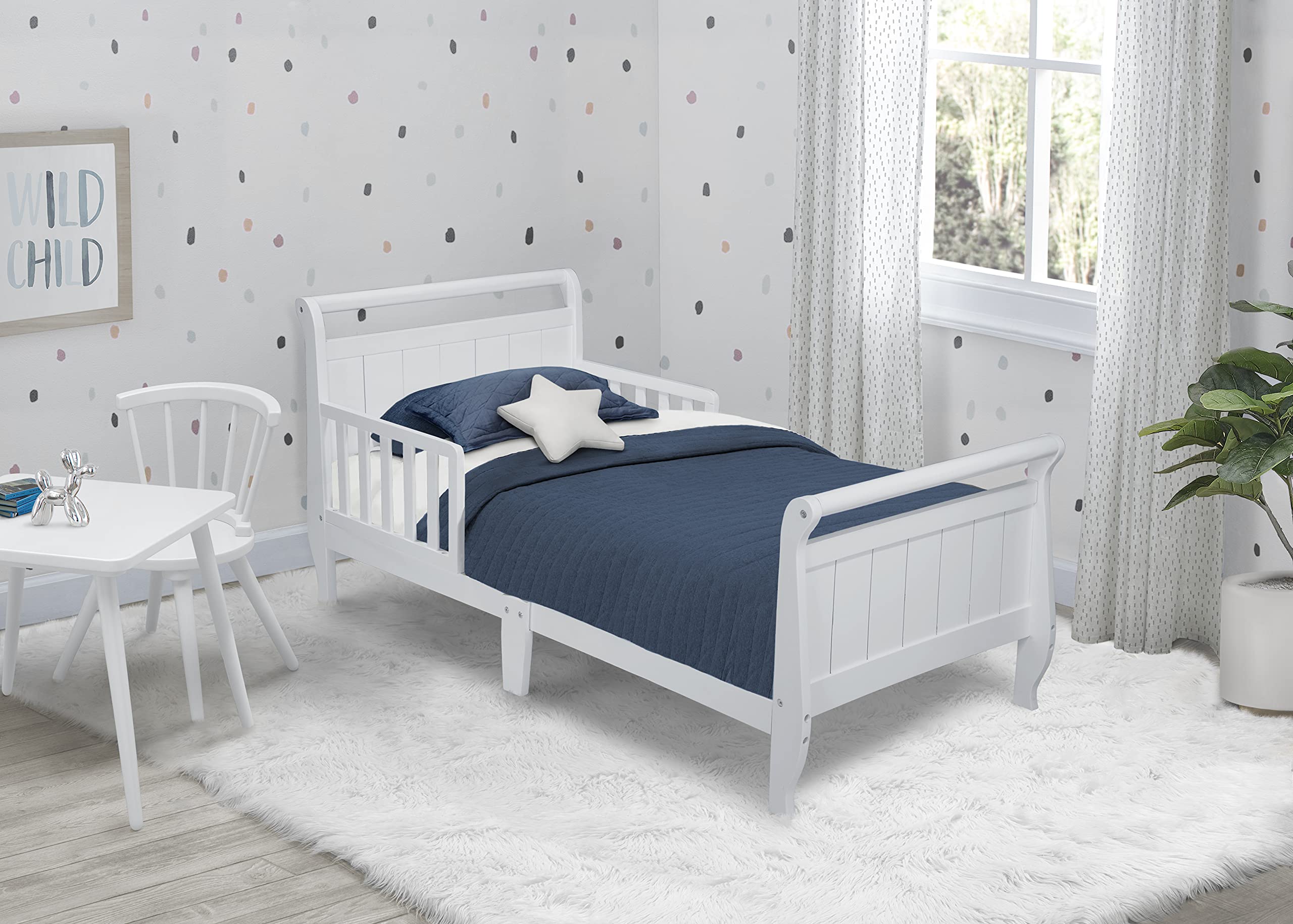 Delta Children White Wood Toddler Sleigh Bed - Convertible Crib for Kids, Safe & Sturdy Nursery Furniture for Baby's First Bed Transition