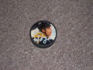 Boston Bruins Milan Lucic Autographed Hockey Puck with Photo - Official NHL Memorabilia for Collectors & Fans - Perfect for Man Cave, Sports Room Decor, Gift for Hockey Lovers