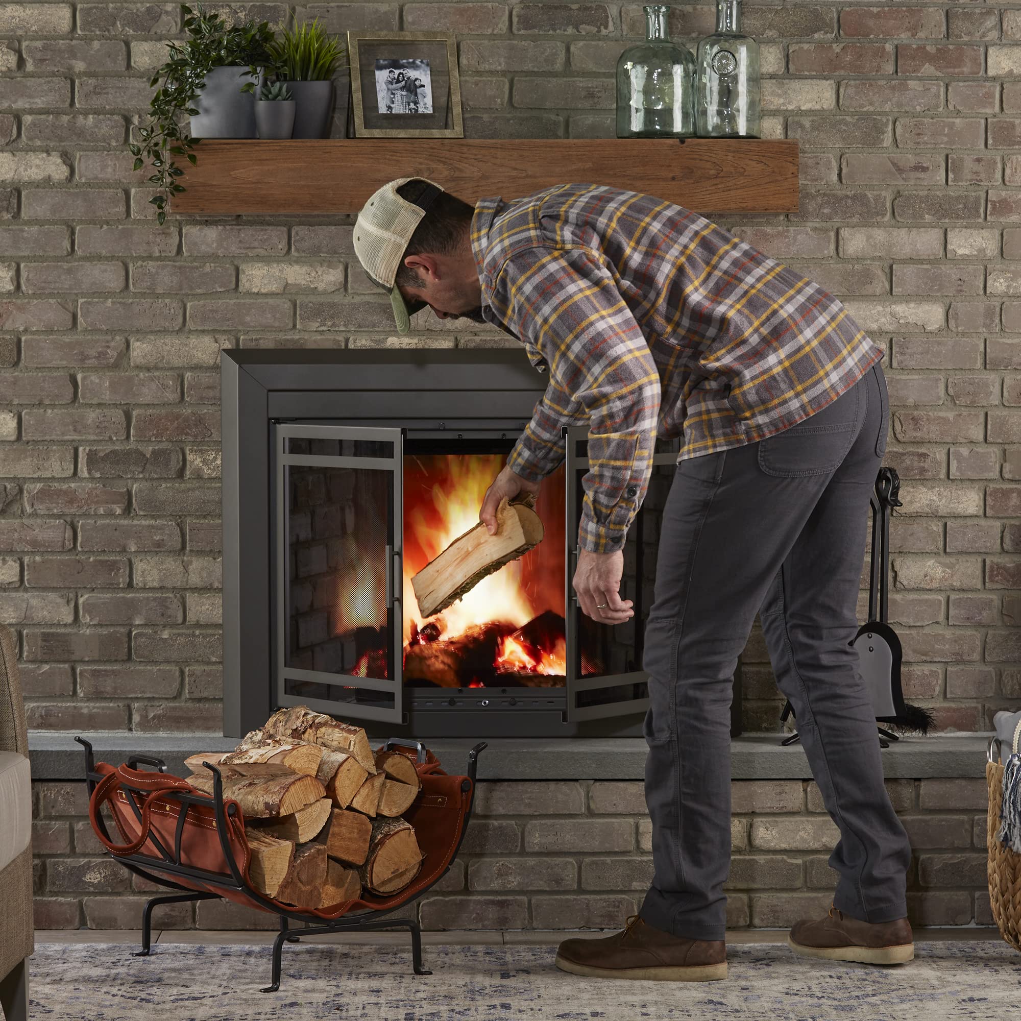 UniFlame Black Wrought Iron Firewood Log Holder with Leather Carrier - Outdoor Firewood Storage for Fireplace, Camping, and Patio Use