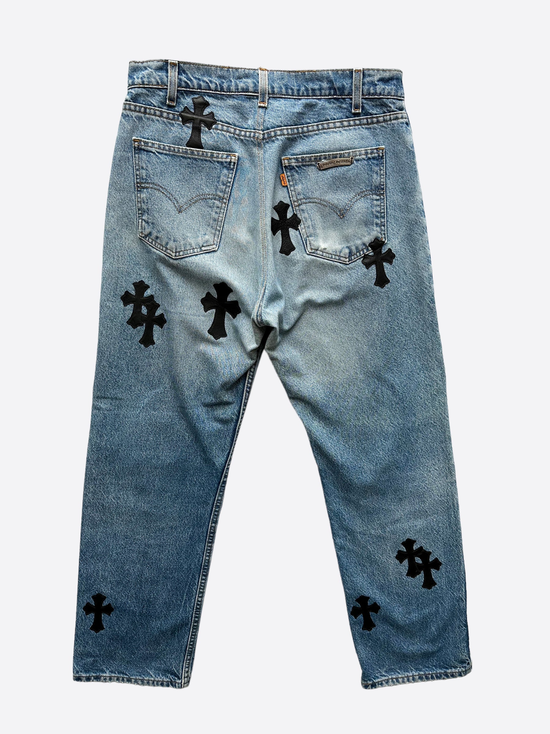 Chrome Hearts x Levi's Light Blue Distressed Jeans with Black Leather Cross Patch - Stylish Vintage Denim for Men's Streetwear & Casual Outfits