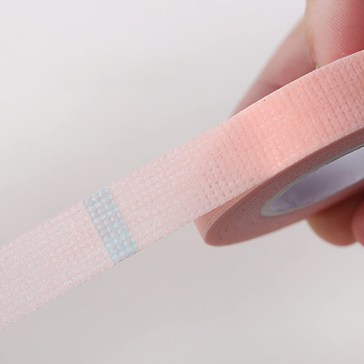 FRCOLOR 7 Rolls Eyelash Extension Tape - Breathable Non-Woven Lash Adhesive Strips with Holes for Professional & DIY Eyelash Grafting | Perfect for Salon, Home Use & Makeup Artists