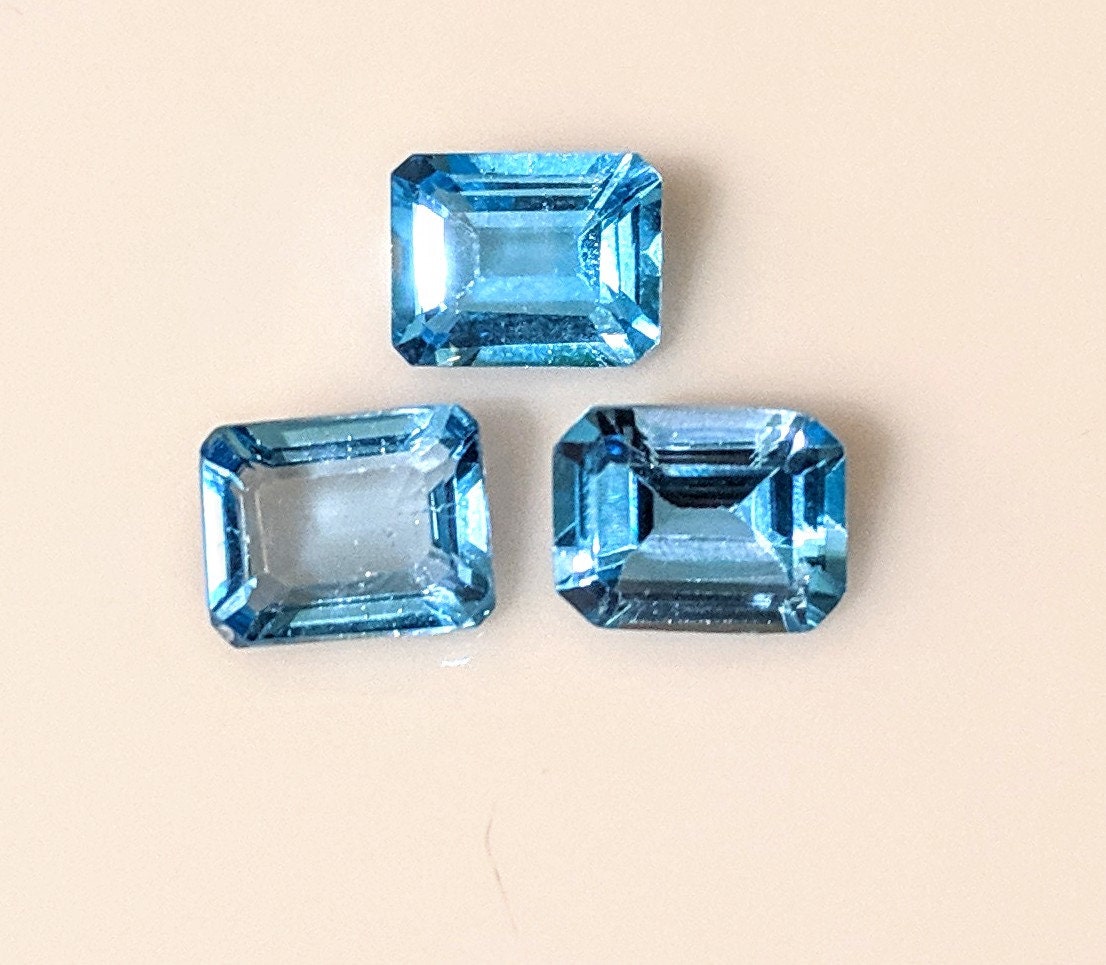 3-Piece Lot of Natural African Swiss Blue Topaz Loose Stones - 9x7mm Emerald Cut, 8.28ct Total Weight, VVS Eye Clean Quality for Jewelry Making, Engagement Rings & Custom Designs