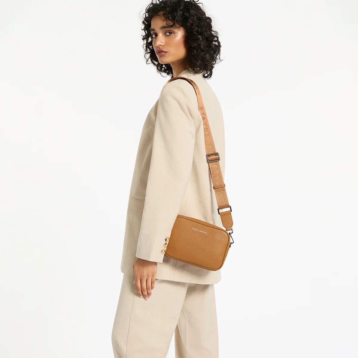 Status Anxiety Plunder Crossbody Bag with Webbed Strap in Tan - Perfect for Everyday Use, Travel & Casual Outings
