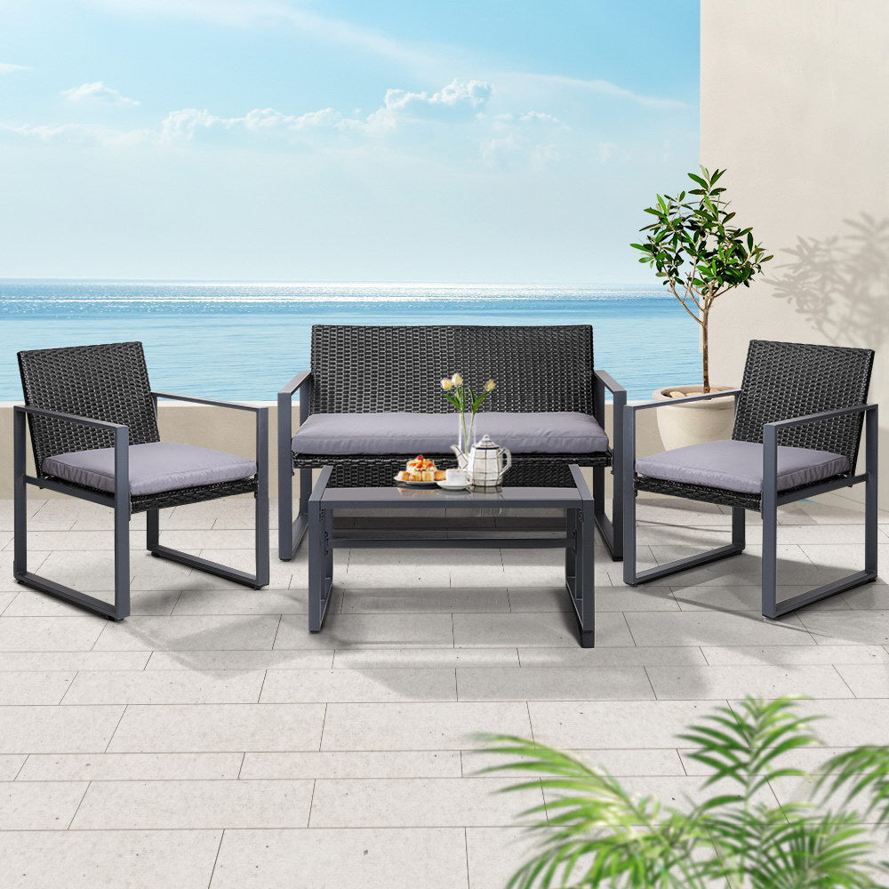4-Piece Outdoor Rattan Sofa Set with Glass Top Table and Chairs - Black Patio Furniture for Garden, Poolside, and Backyard Relaxation