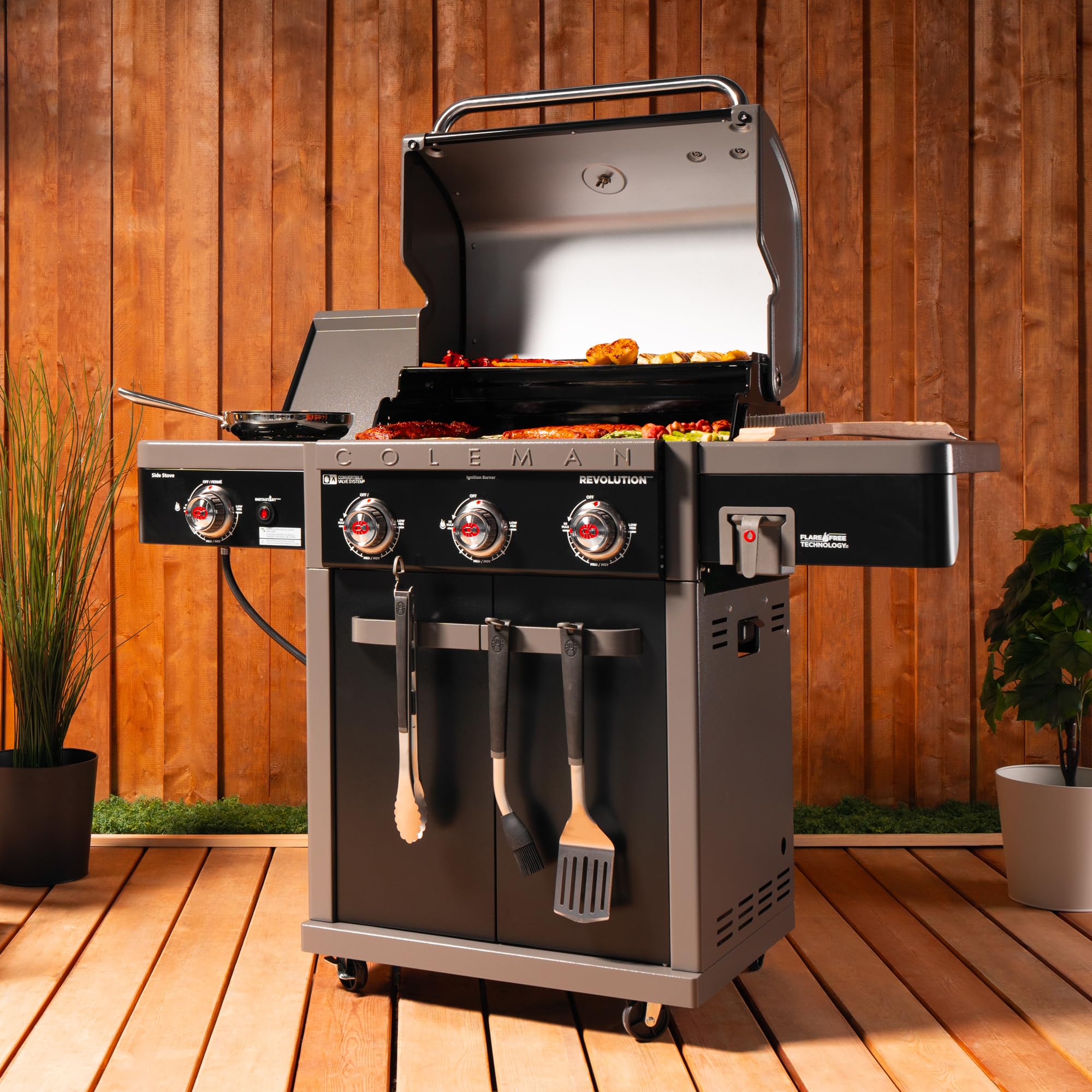 **Coleman Revolution 3-Burner 45,000 BTU Portable Propane Gas Grill with Side Burner – 650 Sq. In. Cooking Surface, Flare-Free Grates & 4-Wheel Cart – Black/Gray – Ideal for Camping, Tailgating & Backyard BBQs**