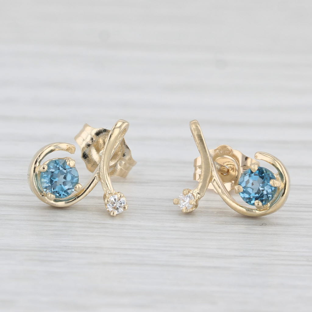0.48ctw Blue Topaz & Diamond Swirl Stud Earrings in 14k Yellow Gold - Elegant Jewelry for Women, Perfect for Weddings, Parties & Special Occasions