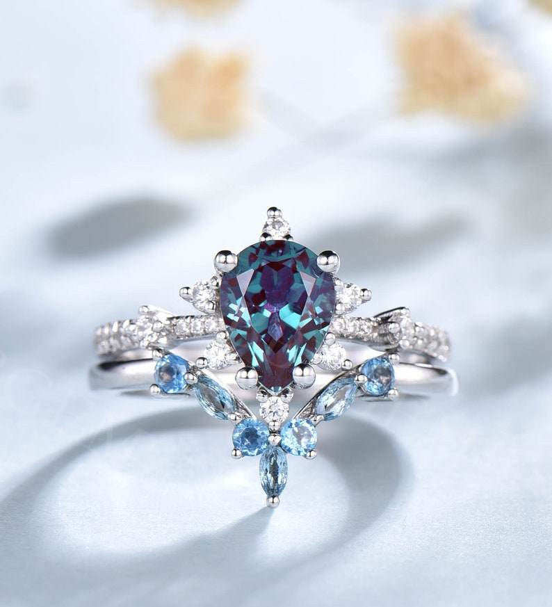 Exquisite Pear Cut Alexandrite Engagement Ring with Curved Topaz Matching Band - Perfect for Proposals, Anniversaries & Special Occasions