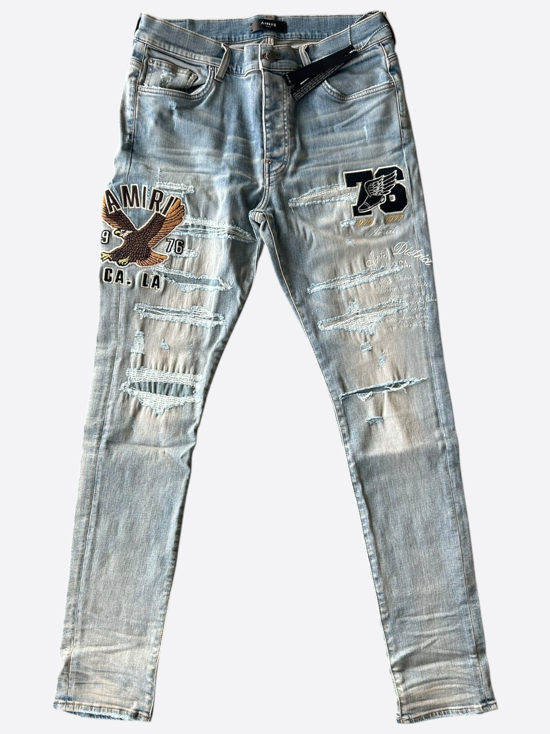 Amiri Antique Indigo Eagle Varsity Applique Logo Jeans for Men - Vintage Denim Pants with Embroidered Patch Design - Perfect for Casual Wear, Street Style & Night Out