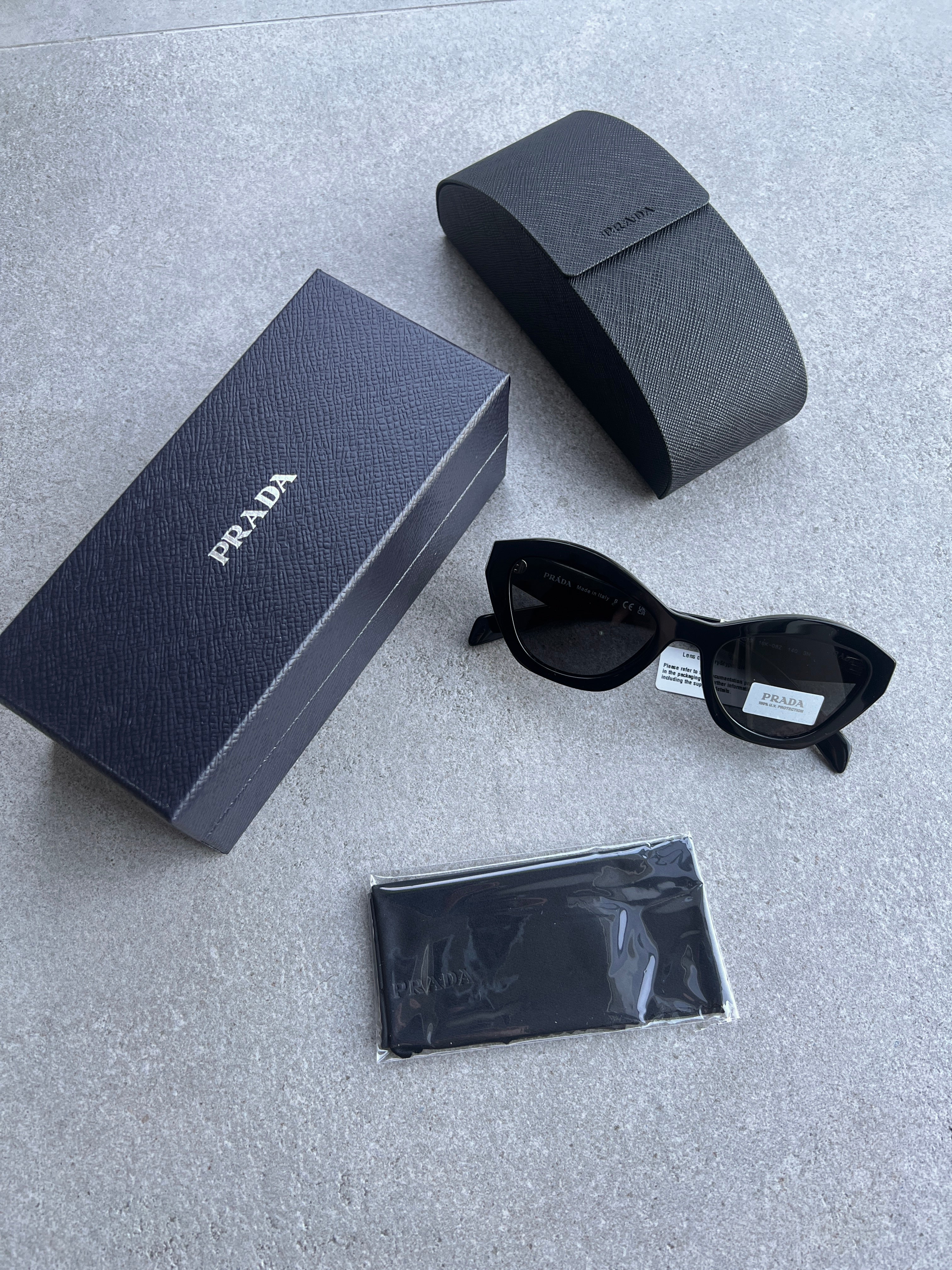 PRADA PR26ZSF Symbole Oval Sunglasses for Women - Black Cat Eye Sunglasses with UV Protection | Perfect for Beach, Driving & Fashion Accessories