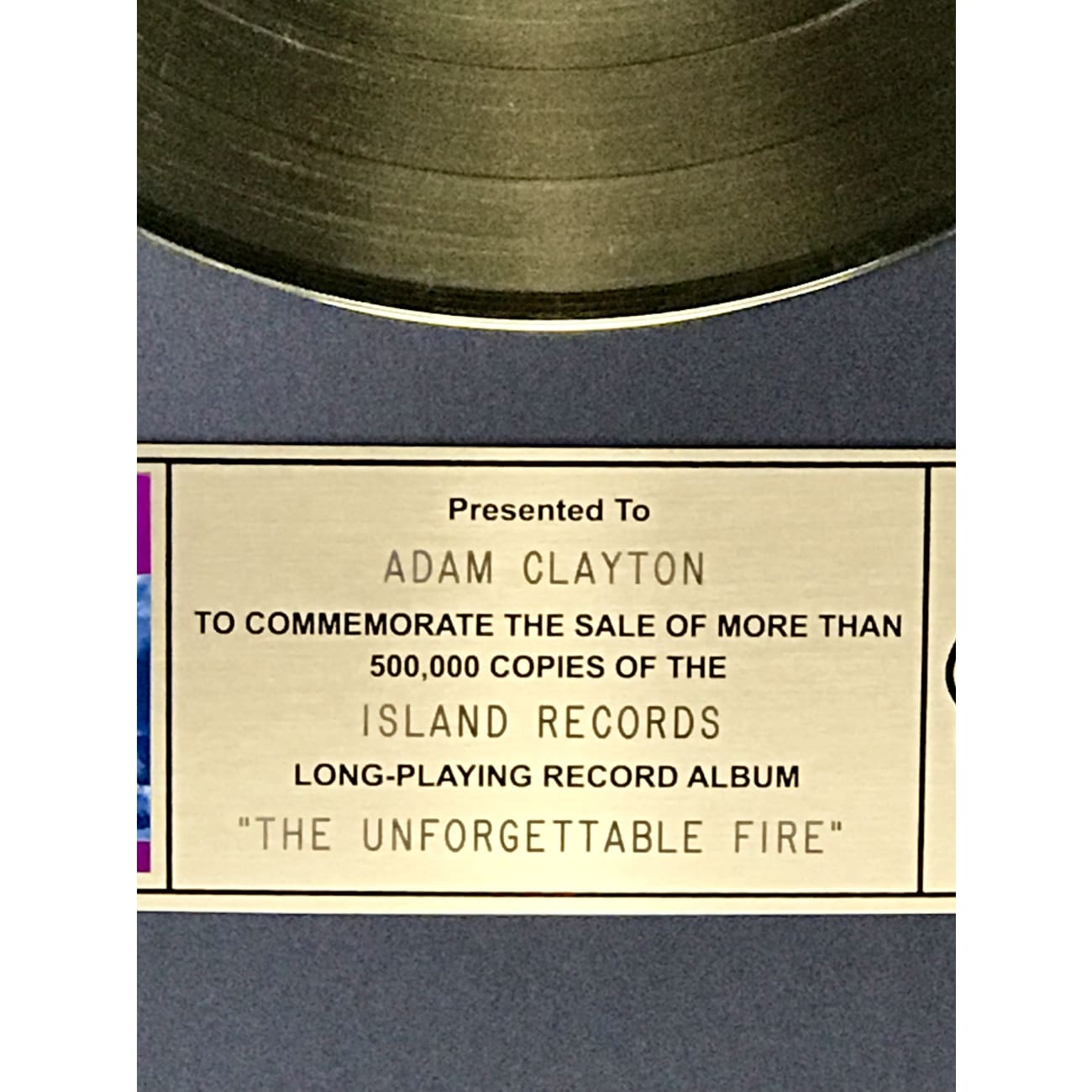 U2 The Unforgettable Fire RIAA Gold LP Award Presented to Adam Clayton - Rare Collectible Vinyl Record for Music Enthusiasts & U2 Fans - Perfect for Display in Music Rooms, Theaters, or Collector's Showcases